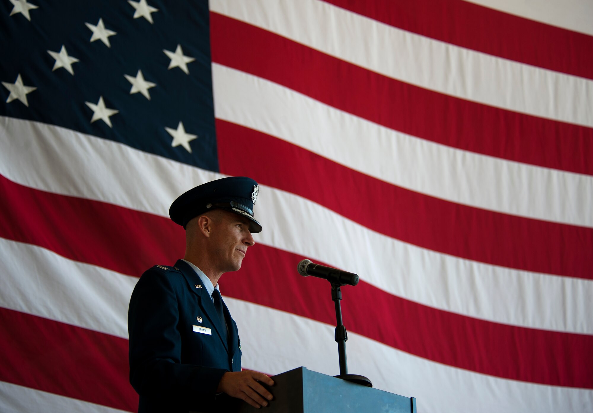 U.S. Air Force Col. Jeffery S. Brown, 317th Airlift Group commander, speaks to the audience Aug. 5, 2013, during a change of command ceremony at Dyess Air Force Base, Texas. Brown is the new commander of the group, which is home to the 39th and 40th Airlift Squadrons and the largest C-130J fleet in the world. (U.S. Air Force photo by Airman 1st Class Damon Kasberg/Released)