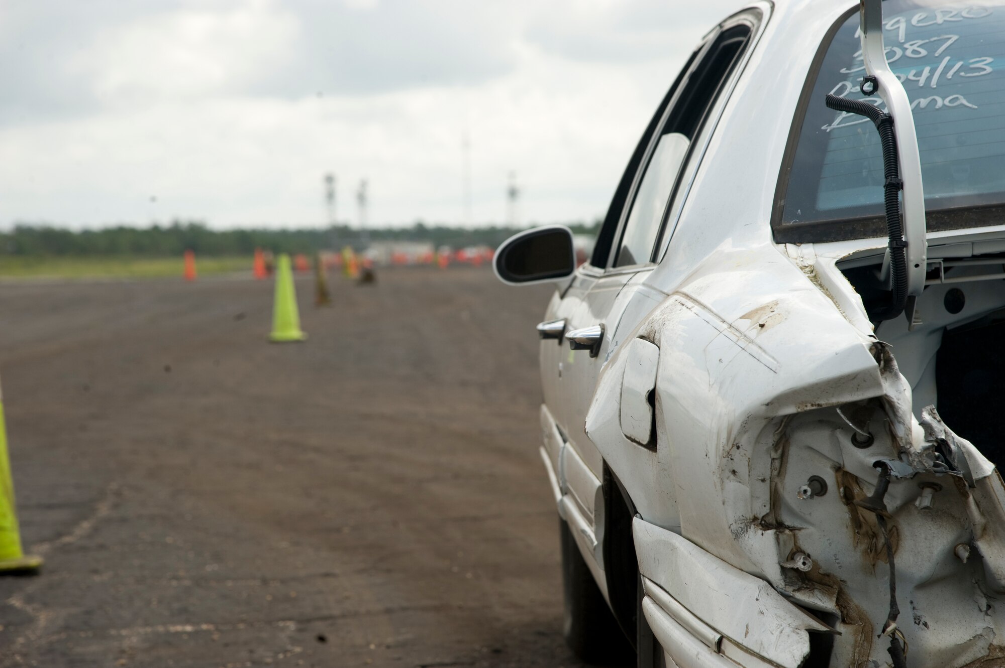 A student waits to navigate a driving course during the Combat Aviation Advisor Military Qualification Skills Course on Eglin Range, Fla., June 18, 2013.  Although the cars receive a fair amount of punishment during training, there are experienced mechanics on standby who maintain the cars to make sure they run adequately, which often does not reflect cosmetically.  (U.S. Air Force photo by Airman 1st Class Benjamin Kim)  