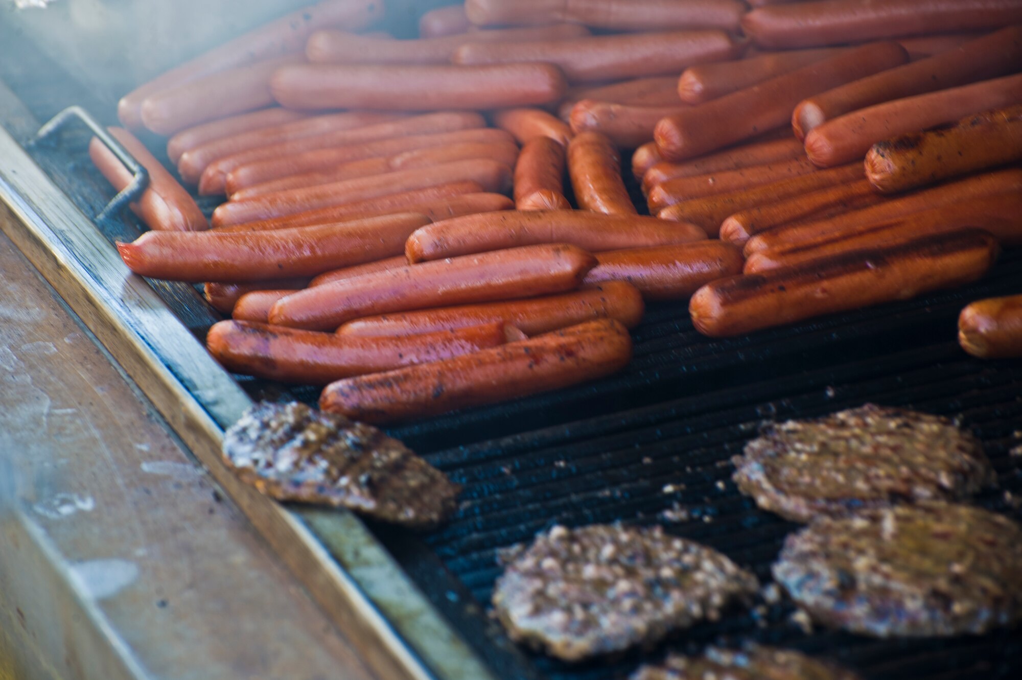 Hot dogs and hamburgers were enjoyed by the large crowd during Cannon Appreciation Day at Cannon Air Force Base, N.M., Aug. 2, 2013. The Clovis/Curry County Chamber of Commerce, Committee of Fifty and the Clovis Industrial Development Corporation came together to sponsor the event for members of the Cannon community. (U.S. Air Force photo/by Airman 1st Class Xavier Lockley)