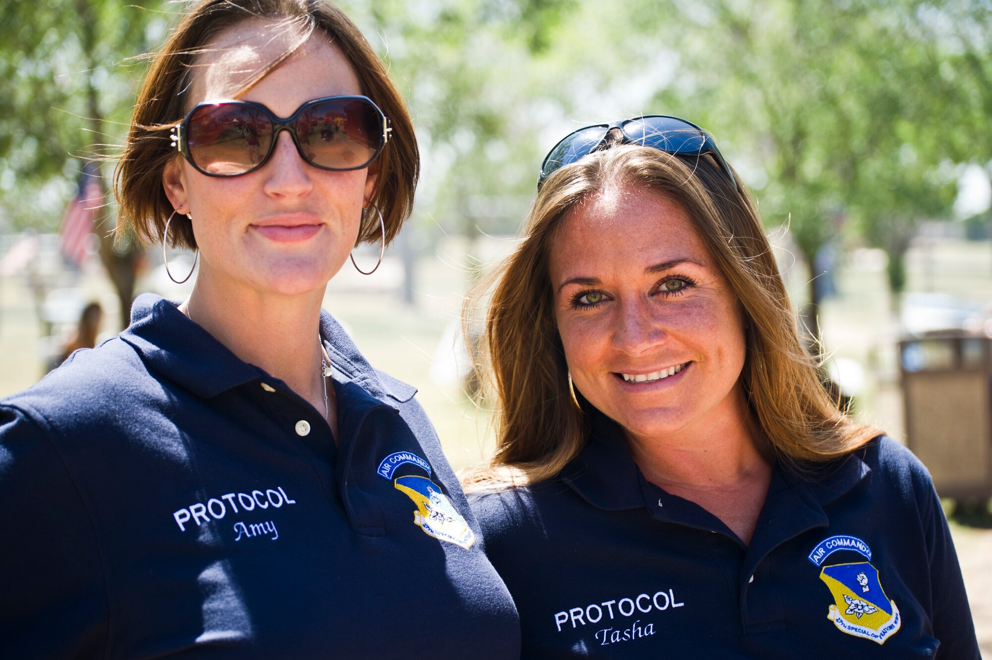 U.S. Air Force Tech. Sgt. Amy Everhard, 27th Special Operations Wing Protocol and Tech. Sgt. Tasha Silveira, 27th Special Operations Wing Protocol NCO in charge, pose for a photo during Cannon Appreciation Day at Cannon Air Force Base, N.M., Aug. 2, 2013. The Clovis/Curry County Chamber of Commerce, Committee of Fifty and the Clovis Industrial Development Corporation came together to sponsor the event for members of the Cannon community. (U.S. Air Force photo/by Airman 1st Class Xavier Lockley)