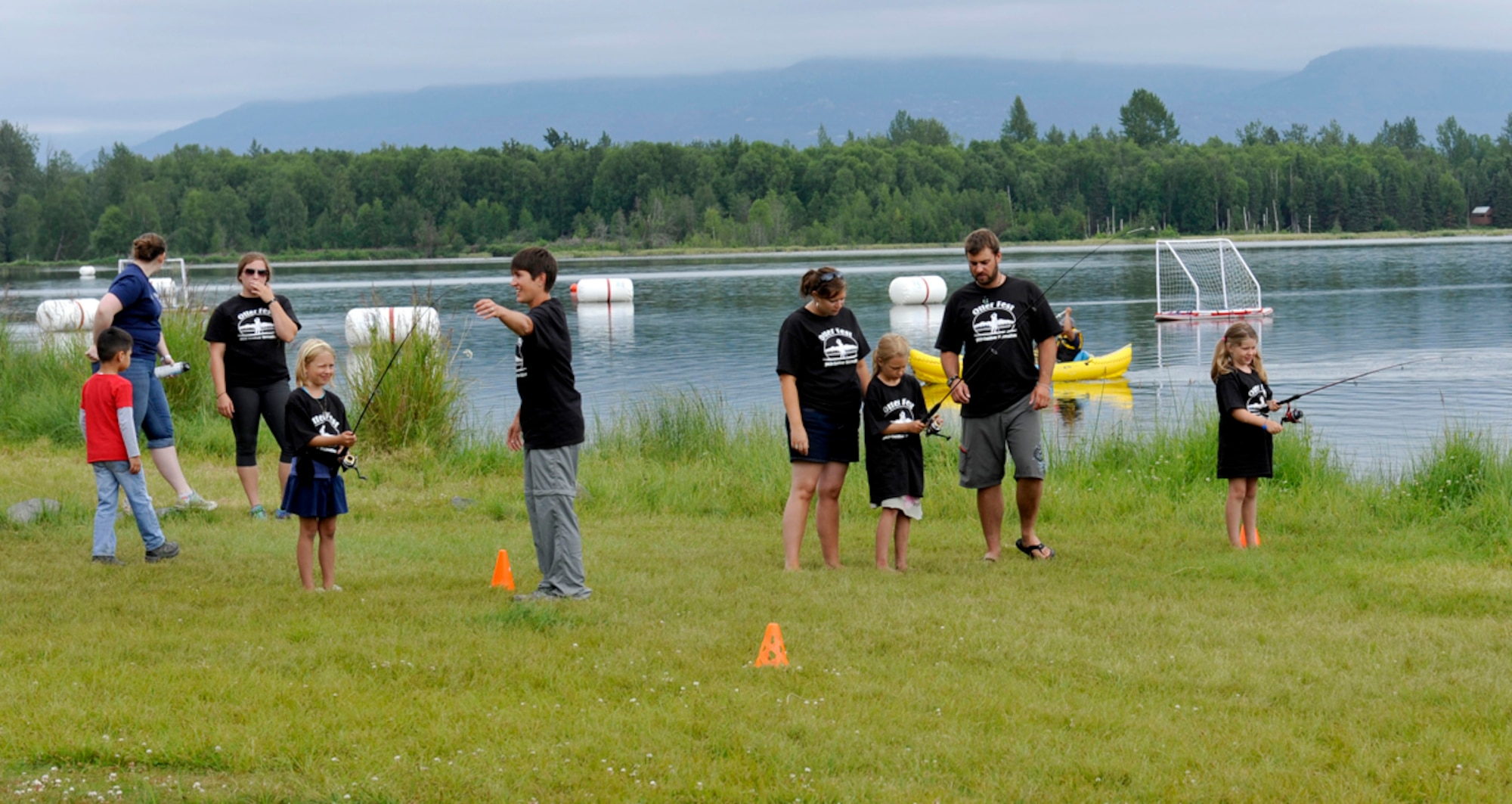 Children receive pre-competition training for the long cast competition on Joint Base Elmendorf-Richardson, Alaska, July 27. The competition was one of five events during the inaugural Otter Fest hosted by the Outdoor Recreation Center. (U.S. Air Force photo/Airman 1st Class Tammie Ramsouer)