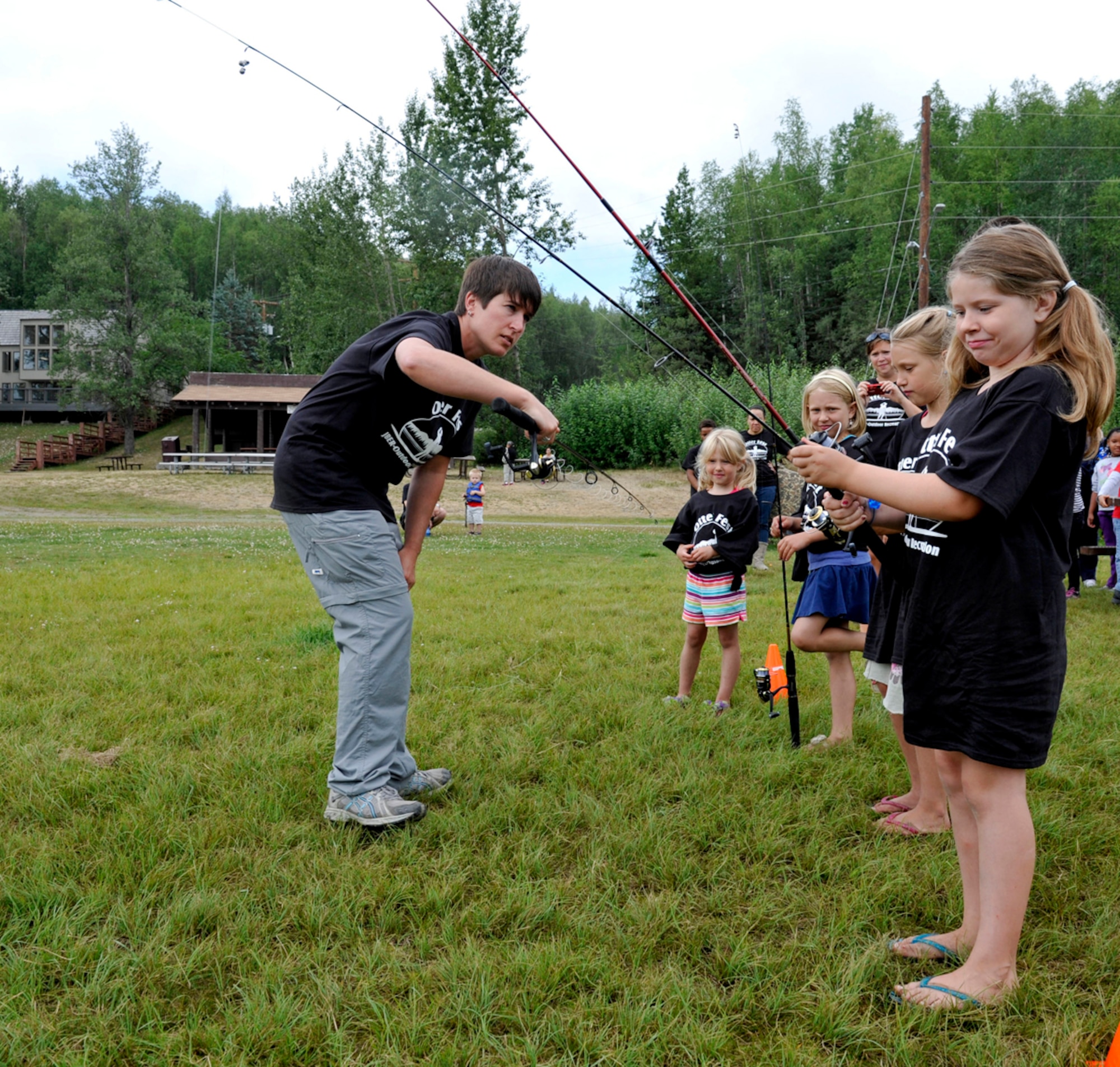 Children receive pre-competition training for the long cast competition on Joint Base Elmendorf-Richardson, Alaska, July 27. The competition was one of five events during the inaugural Otter Fest hosted by the Outdoor Recreation Center. (U.S. Air Force photo/Airman 1st Class Tammie Ramsouer)