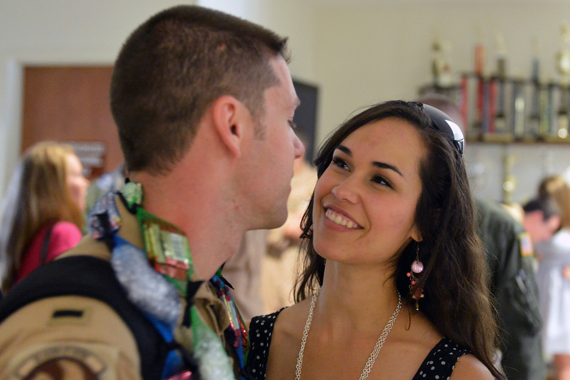 1st. Lt Eric De Gruchy, 7th Airlift Squadron pilot, shares a moment with his wife at Joint Base Lewis-McChord, Wash., upon his return from a 60-day deployment, Aug. 3, 2013. Airmen from the 7th AS provided airlift, airdrop, aeromedical evacuation and humanitarian relief, transporting personnel, equipment and supplies throughout the assigned areas of responsibility. (U.S. Air Force photo/Airman 1st Class Jacob Jimenez) 
