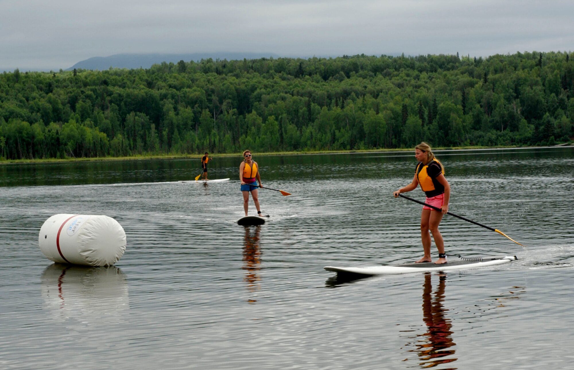 Participants practice on stand-up-boards for the stand-up-board competition during Otter Fest on Joint Base Elmendorf-Richardson, Alaska, July 27. The stand-up-board races was the last race of the inaugural Otter Fest hosted by the Outdoor Recreation Center. (U.S. Air Force photo/Airman 1st Class Tammie Ramsouer)