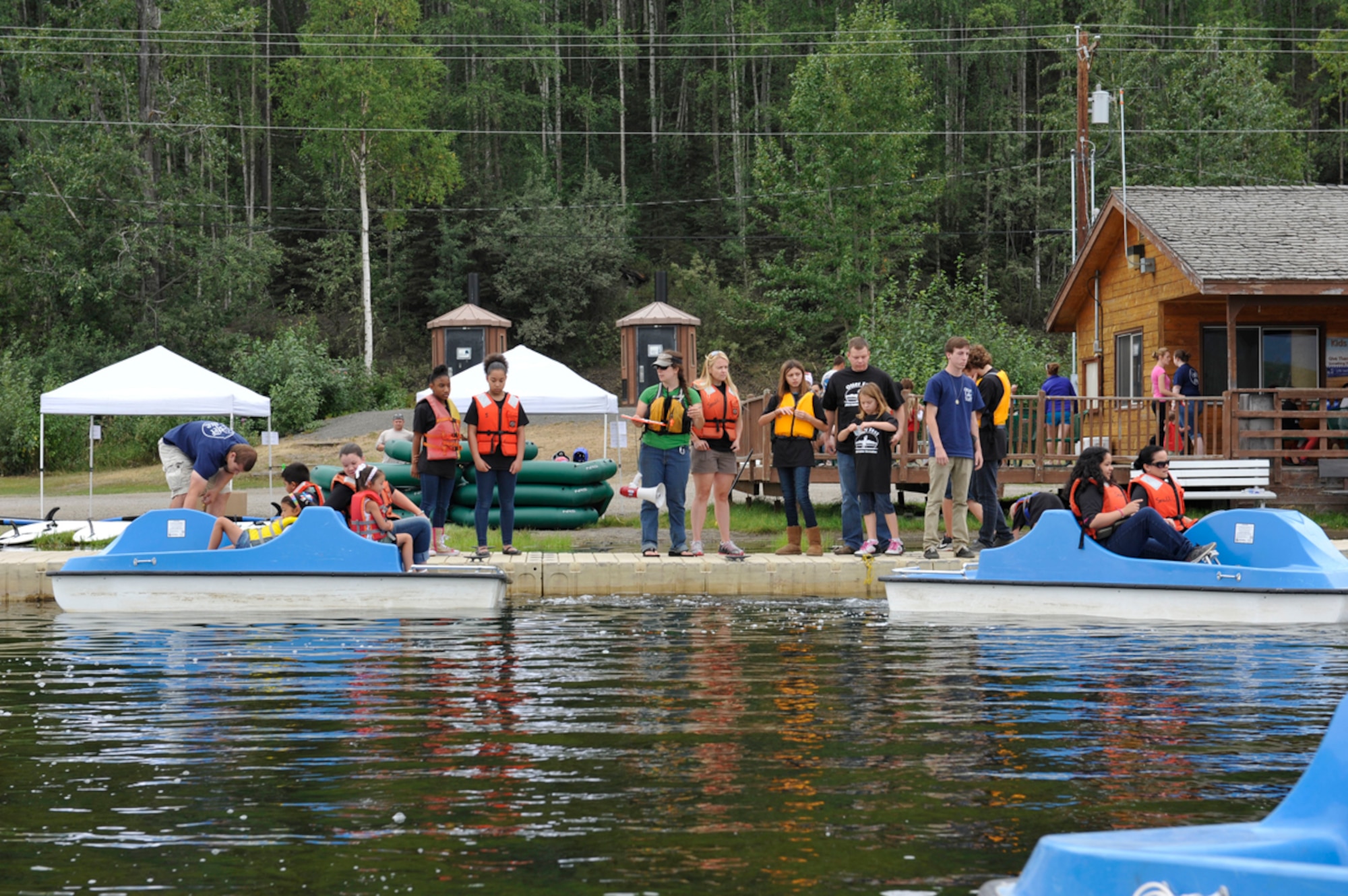 Military members and their families line up to participate in the paddle boat race during Otter Fest on Joint Base Elmendorf-Richardson, Alaska, July 27. This was the first ever Otter Fest the recreation center has hosted to show individuals they can have fun and stay safe on the water. (U.S. Air Force photo/Airman 1st Class Tammie Ramsouer)