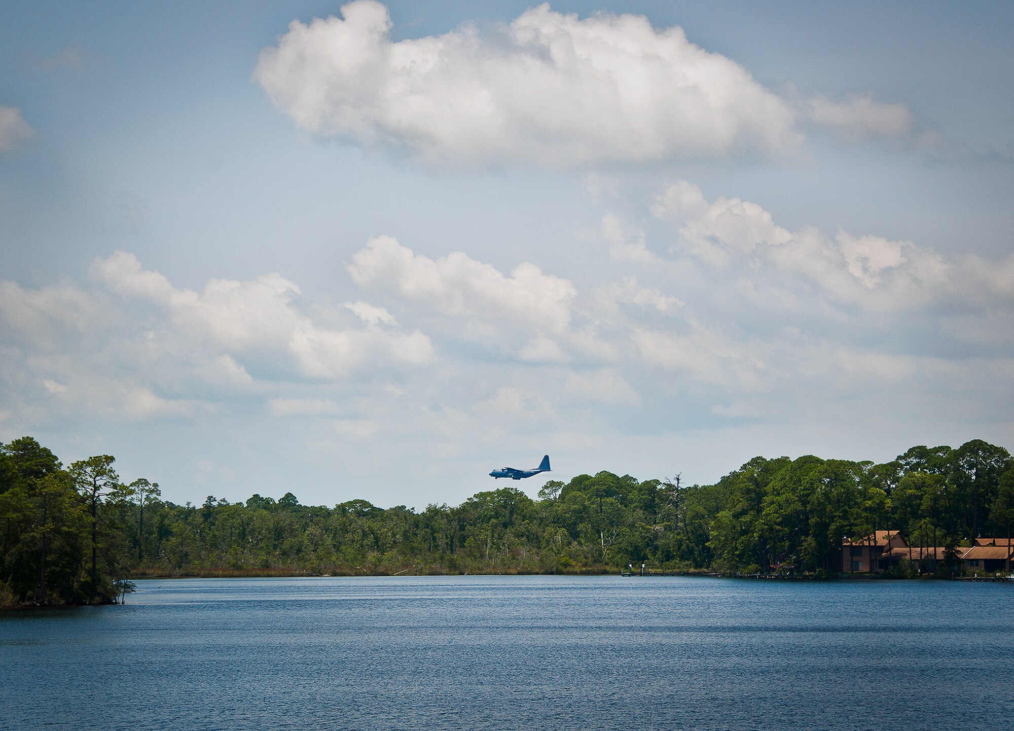 A C-130 performs touch-n-goes to Eglin Air Force Base’s runway 19 Aug. 2.  Aircrews and pilots from Eglin and transient aircraft took advantage of the clear skies to perform pattern work around runways that day.  (U.S. Air Force photo/Samuel King Jr.)