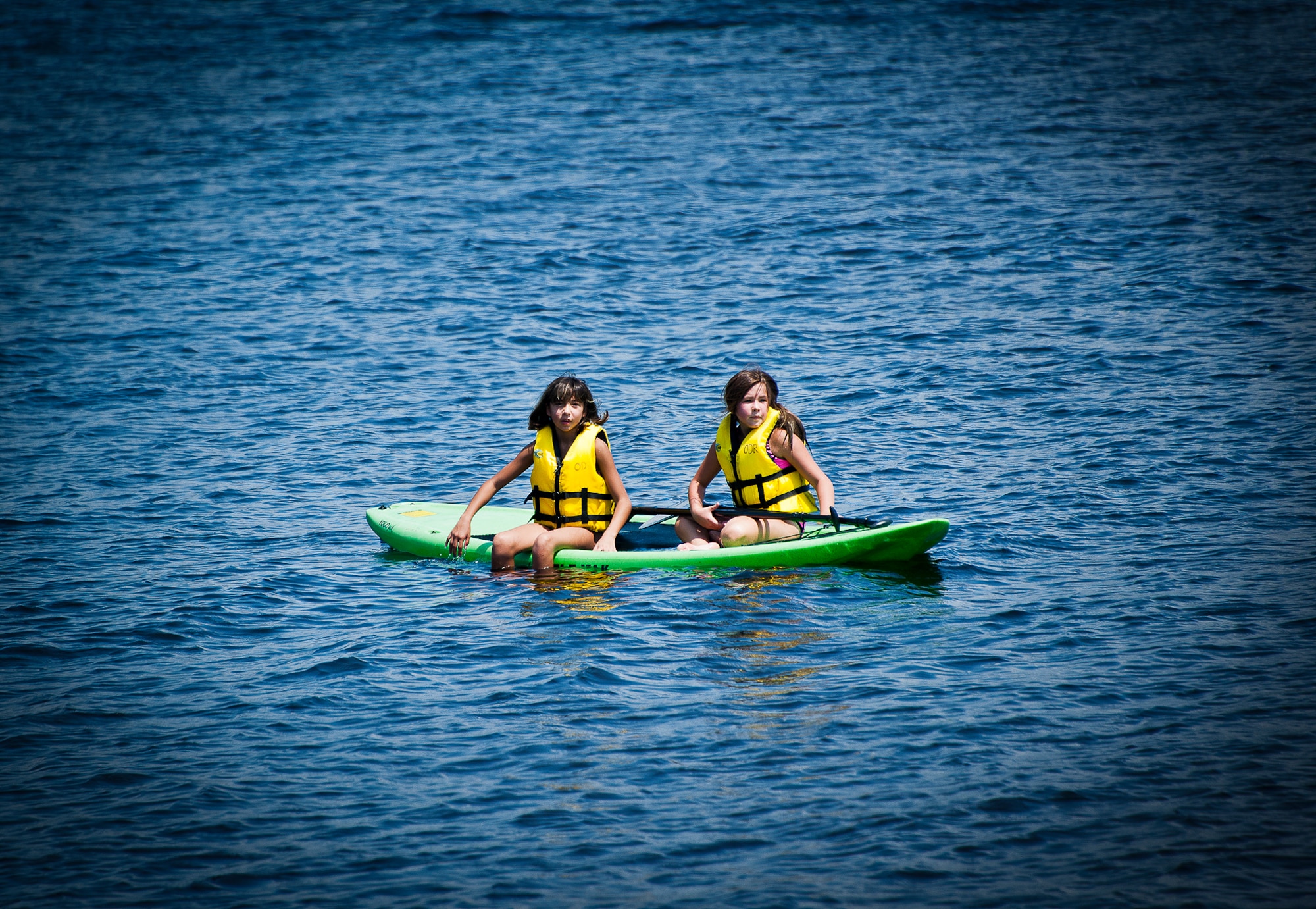 Two friends rest on a paddle board in Boggy Bayou near Post’l Point at Eglin Air Force Base, Fla., Aug. 2.  Eglin offers many outdoor recreation gear and activities to enjoy.  For more information, or to see what’s available go to www.eglinforcesupport.com. (U.S. Air Force photo/Samuel King Jr.)