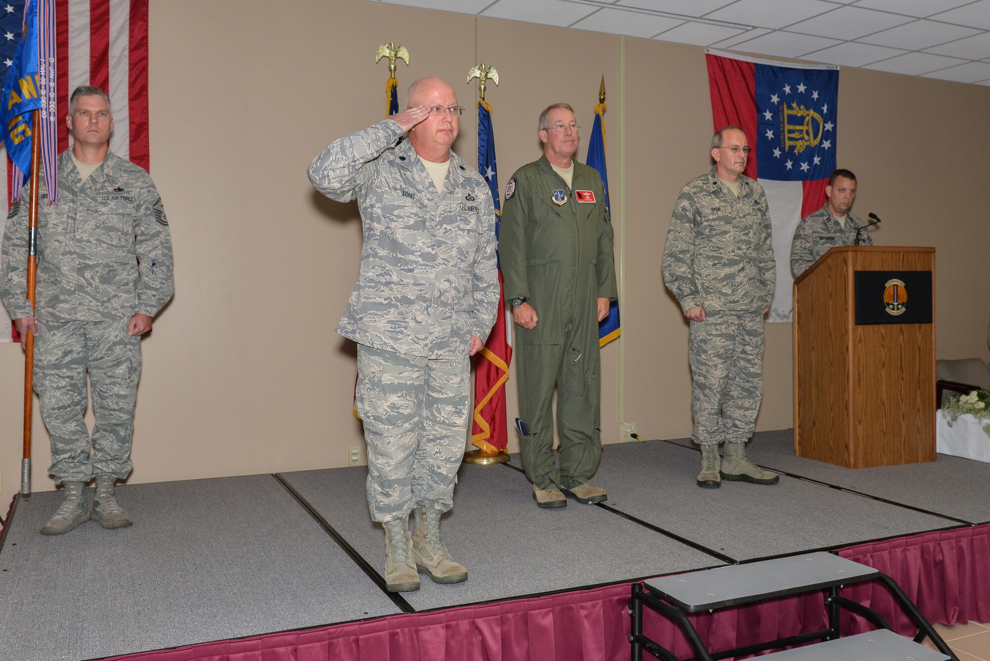 Lt. Col. Victor M. Long gives a final salute as the 117ACS Commander Aug. 3, 2013 at Hunter Army Airfield in Savannah, Ga. Long relinquished command to Lt. Col. Ronald N. Speir, Jr. during a Change of Command Ceremony. (U.S. Air National Guard photo by Tech. Sgt. Charles Delano/released)