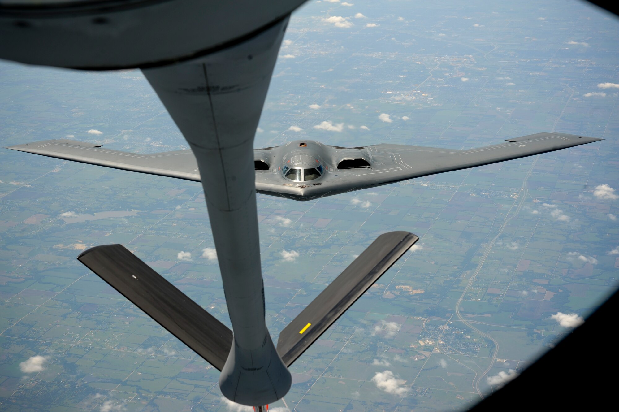 A B-2 Spirit from Whiteman Air Force Base Mo. recedes from the boom of a KC-135 Stratotanker assigned to the 22nd Air Refueling Wing McConnell Air Force Base Kan. Aug. 1, 2013. Stratotankers have provided fuel to aircraft worldwide for over 50 years. (U.S. Air Force Photo/Airman 1st Class John Linzmeier)