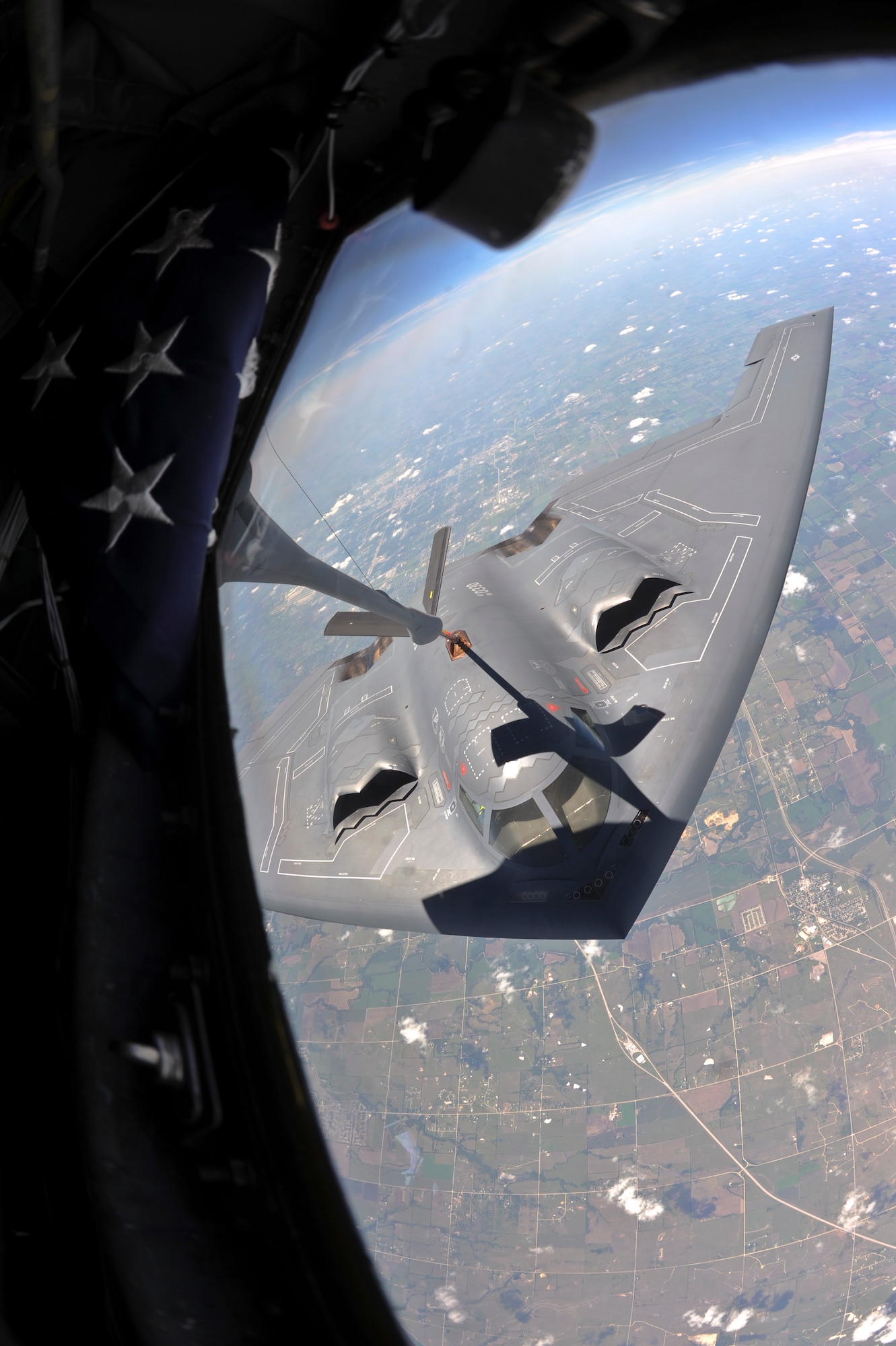 A B-2 Spirit from Whiteman Air Force Base Mo. detaches from the boom of a KC-135 Stratotanker, assigned to the 22nd Air Refueling Wing McConnell Air Force Base Kan., after being refueled Aug. 1, 2013. Spirit’s are built with a radar absorbent coating to preserve its stealth characteristics. (U.S. Air Force Photo/Airman 1st Class John Linzmeier)