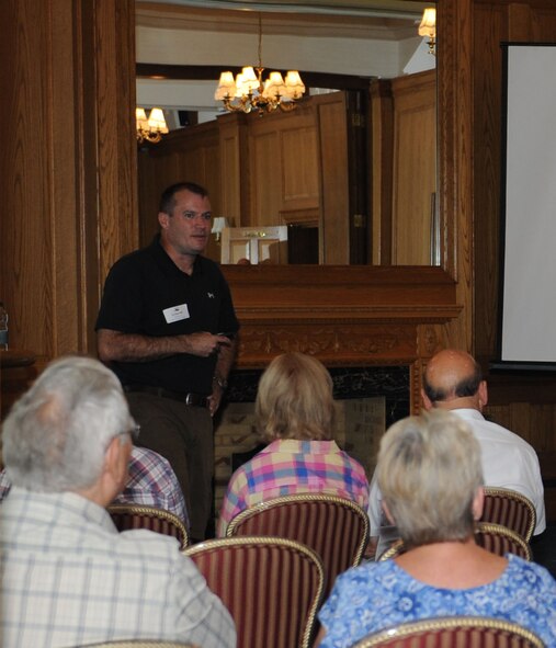 Col. Kenneth T. Bibb Jr., 100th Air Refueling Wing commander, delivers a briefing to local community leaders Aug. 3, 2013, at Middleton Hall on RAF Mildenhall, England. Bibb covered a number of topics, ranging from the economic effect Airmen have on the community to the history of the RAF Mildenhall. The event provided a casual setting where local community leaders could build partnerships with base leadership. (U.S. Air Force photo by Airman 1st Class Preston Webb/Released)