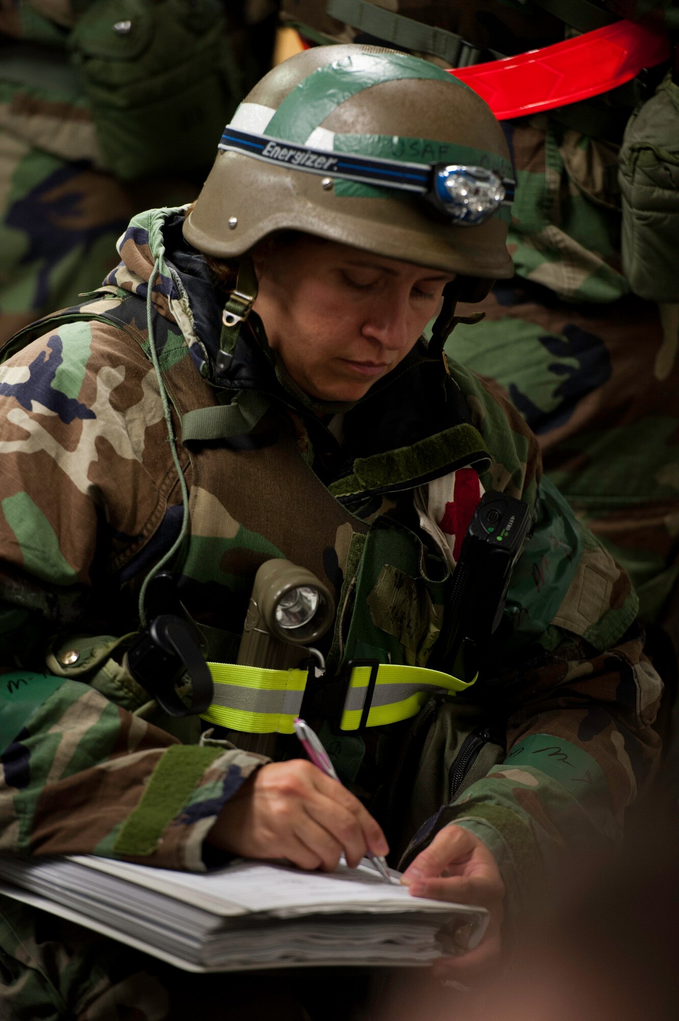 Capt. Karen Vandor, 8th Medical Operations Squadron public heath flight commander, annotates the “patient’s” information prior to prescribing treatment during an exercise at Kunsan Air Base, Republic of Korea, August 5, 2013. Vandor was part of a team helping treat a simulated food-borne illness spreading throughout the base. The scenario tested the 8th Medical Group’s ability to respond properly and in a timely manner. (U.S. Air Force photo by Senior Airman Armando A. Schwier-Morales/ Released)