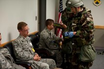 Lt. Col. Taylor Han, 8th Medical Operations Squadron medical director, listens to Staff Sgt. Michael Harkavi’s, 8th Civil Engineer Squadron exercise “victim,” concerns relating to a simulated food-borne illness at Kunsan Air Base, Republic of Korea, August 5, 2013. Wolf Pack Airmen were tested during Beverly Midnight 13-3 in order to accomplish their mission in an environment contaminated by chemical, biological, radiological, nuclear and high-yield explosives. (U.S. Air Force photo by Senior Airman Armando A. Schwier-Morales/ Released)