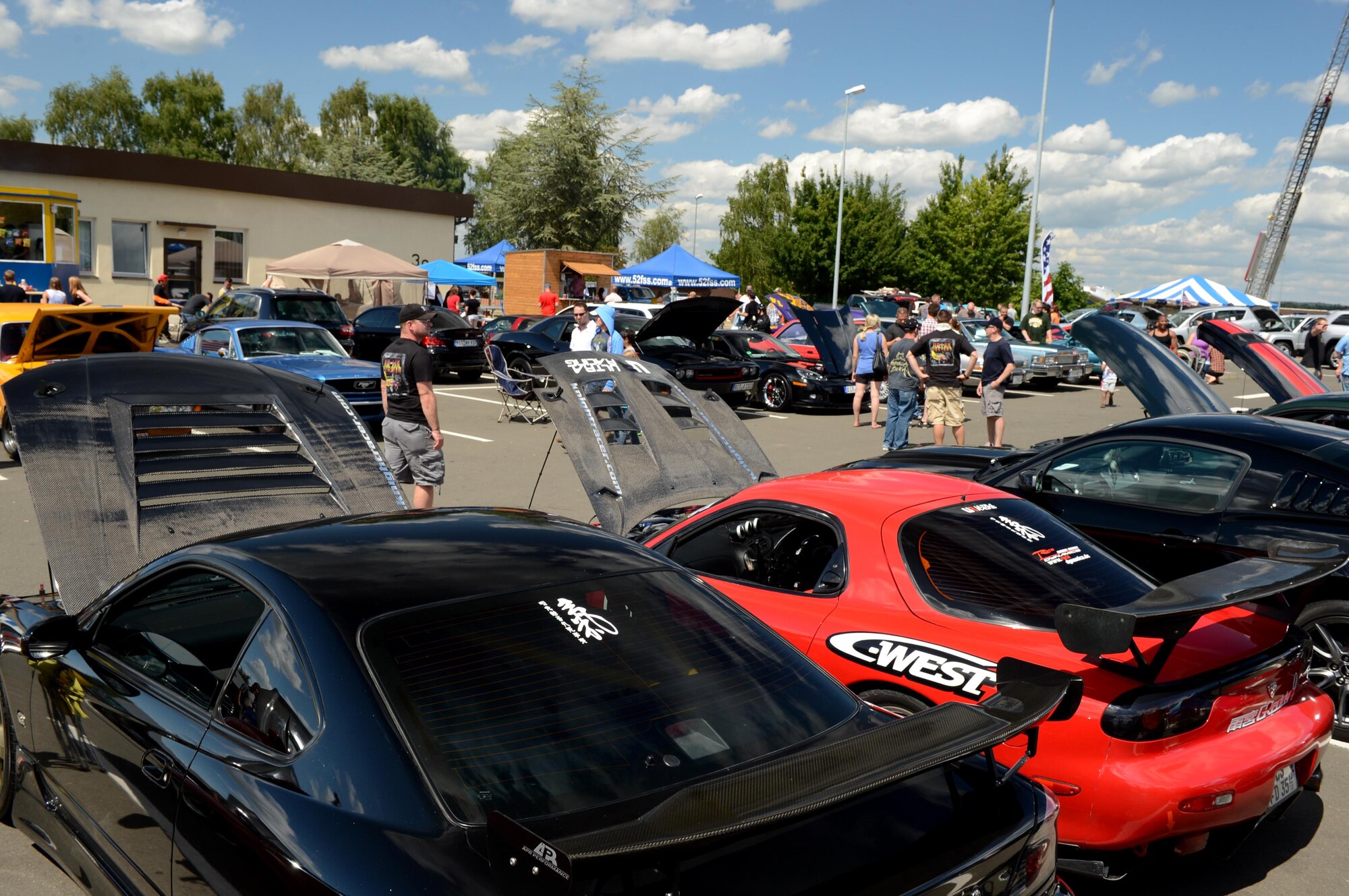 SPANGDAHLEM AIR BASE, Germany – Cars are displayed in a parking lot at the base pavilion in the 12th annual Motor Weekend car competition Aug. 4, 2013. More than 240 cars were registered to compete in three categories of cars, trucks and motorcycles. (U.S. Air Force photo by Airman 1st Class Kyle Gese/Released) 
