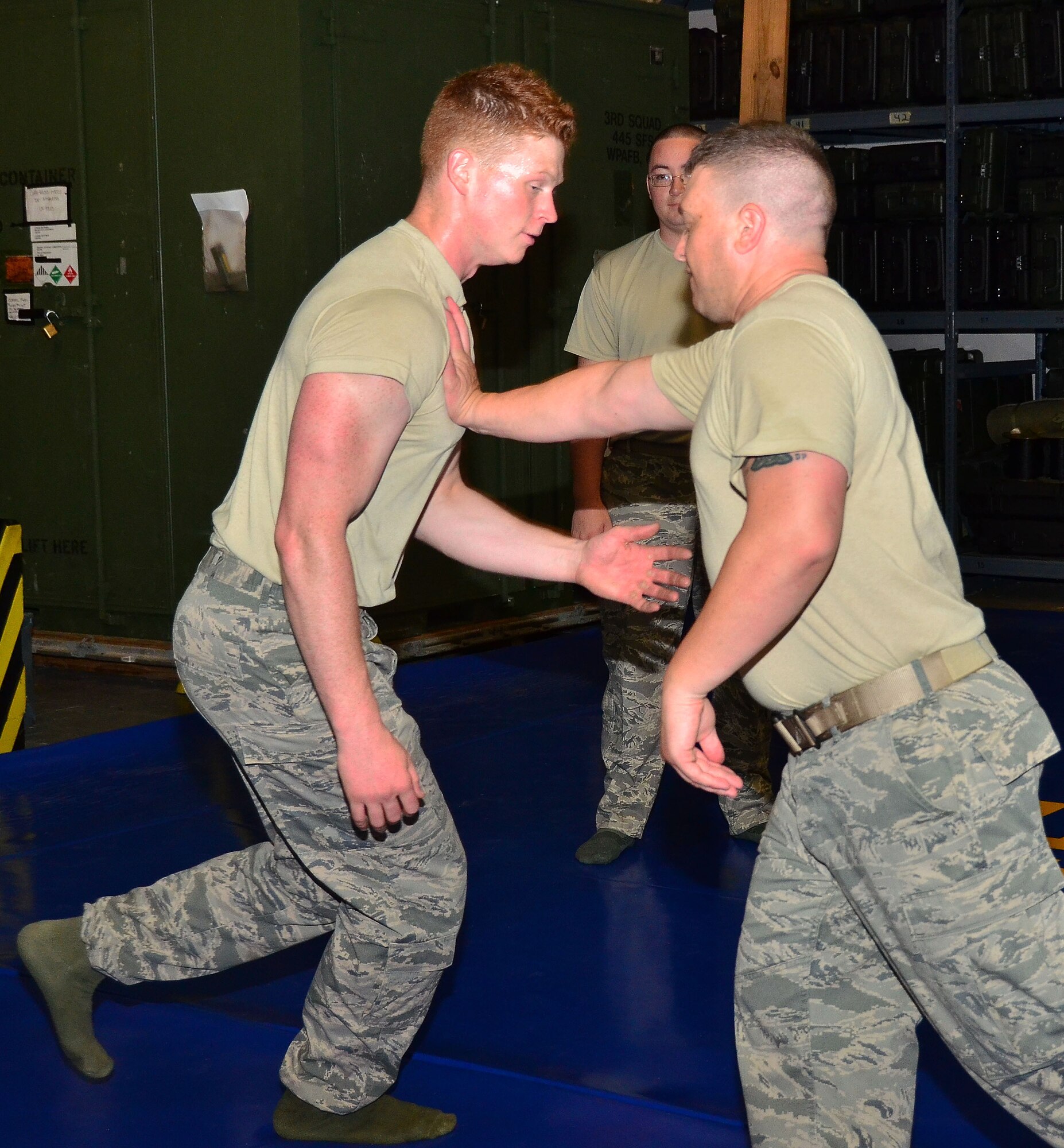 WRIGHT-PATTERSON AIR FORCE BASE, Ohio - Staff Sgt. Michael O’Callaghan, 445th Security Forces Squadron journeyman, teaches new combative techniques while using Senior Airman Shayne Denihan, 445 SFS helper, as a model during the July 13 unit training assembly. (U.S. Air Force photo/Staff Sgt. Amanda Duncan)