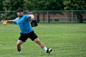 Mui Ailstock, Air Combat Command Installations and Missions Support Directorate team member, throws a ball to the second baseman during the intramural softball championship at Langley Air Force Base, Va., July 31, 2013. The team achieved seven wins and one loss during the regular season, earning them the privilege to play in the final tournament against the 633rd Civil Engineer Squadron team.  (U.S. Air Force photo by Staff Sgt. Stephanie Rubi/Released)