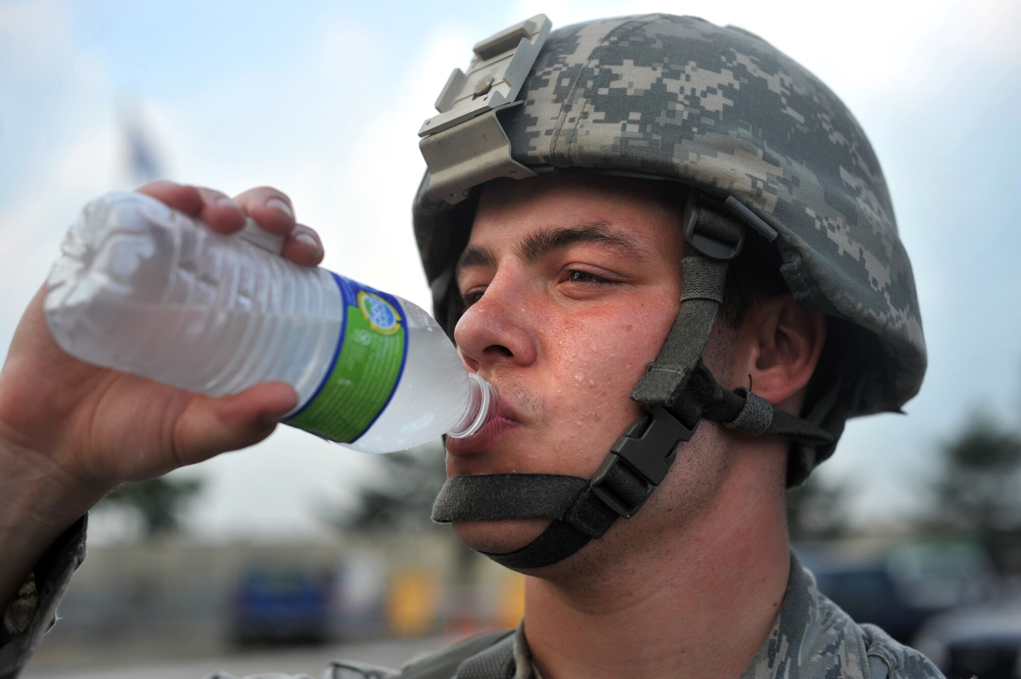 Airman 1st Class Matthew Prichard, 51st Security Forces Squadron member, takes time to hydrate during Operational Readiness Exercise Beverly Midnight 13-03 at Osan Air Base, Republic of Korea, August 5, 2013. With temperatures reaching more than 90 degrees during the week-long exercise, remaining hydrated is imperative for Osan Airmen to successfully complete the mission during the simulated wartime contingency exercise. (U.S. Air Force photo/Senior Airman Kristina Overton)
