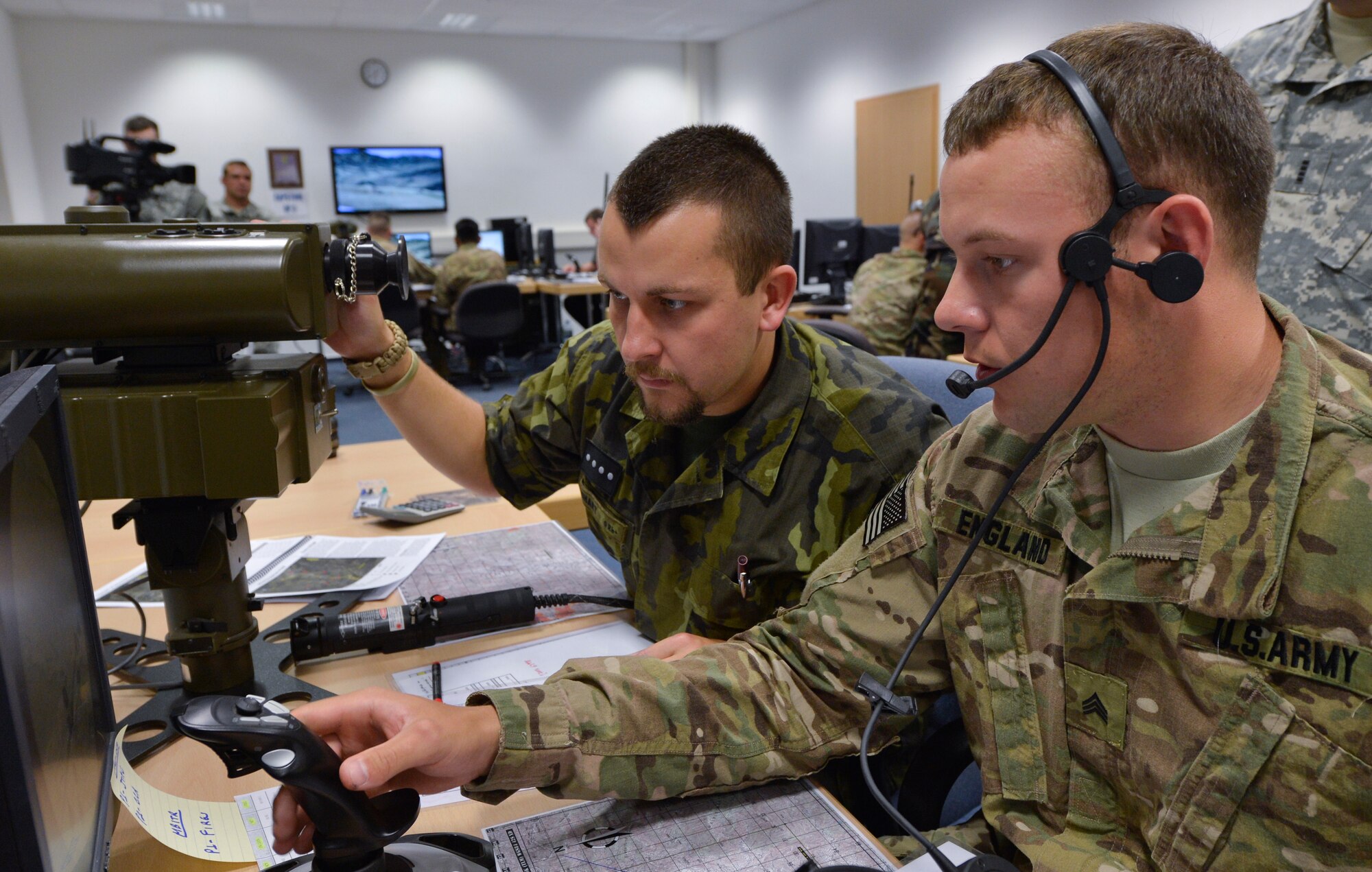 From left to right, Czech Republic armed forces Staff Sgt. Petra Manhart, 13th Artillery Brigade artillery reconnaissance platoon gun commander, works with U.S. Army Sgt. Matthew England, 2nd Calvary Regiment infantryman, in the first ever multinational Joint Fire Observer course, July 25, 2013, Einsiedlerhof Air Station, Germany. (U.S. Air Force photo/Airman 1st Class Jordan Castelan)