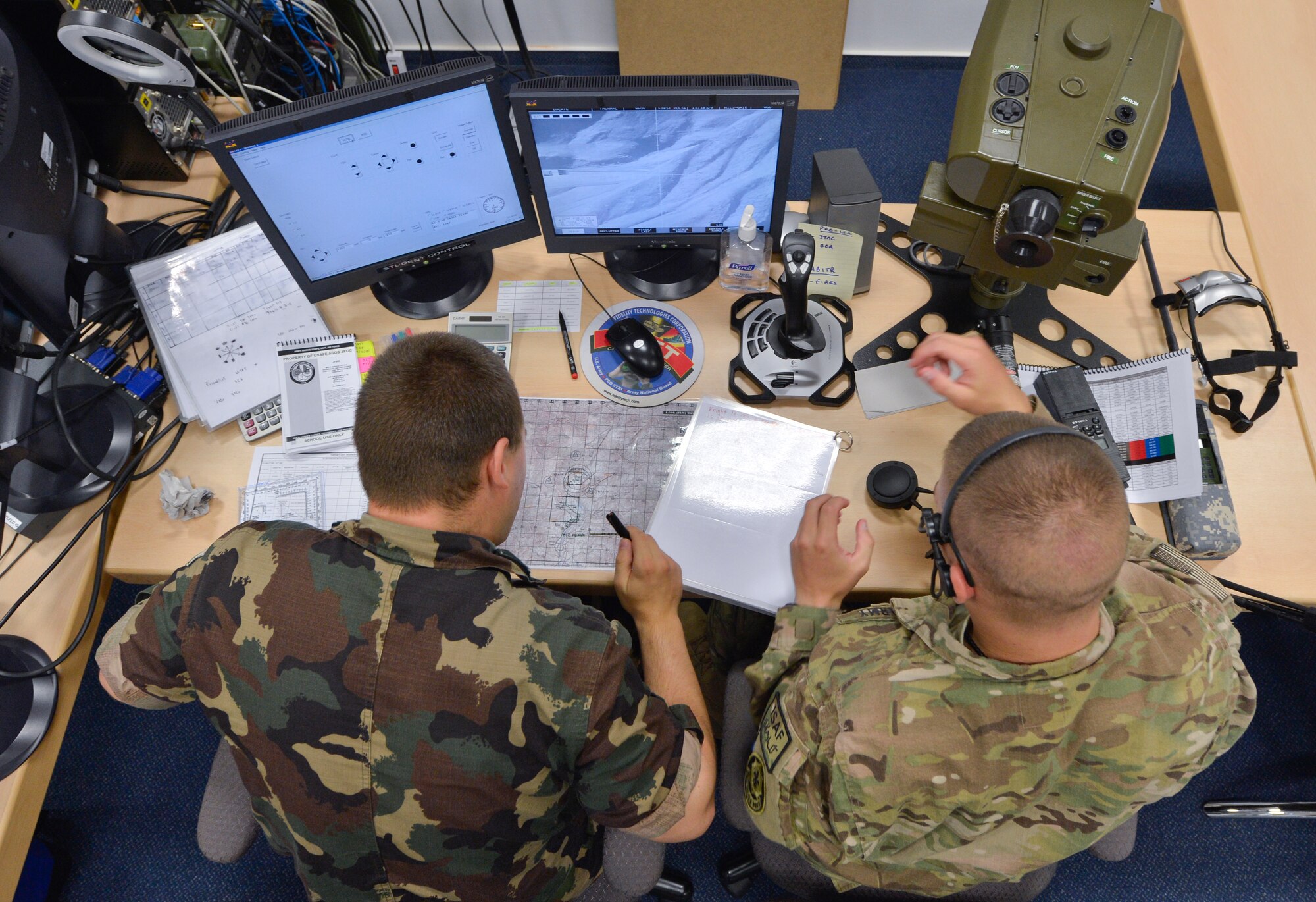 From left to right, Hungarian army 1st Lt. Nicolas Vétek, 25th Rifle Brigade, battery commander, works with U.S. Army Pfc. Douglas Burke, 2nd Calvary Regiment forward observer, in the first ever multinational Joint Fire Observer course, July 25, 2013, Einsiedlerhof Air Station, Germany. (U.S. Air Force photo/Airman 1st Class Jordan Castelan)