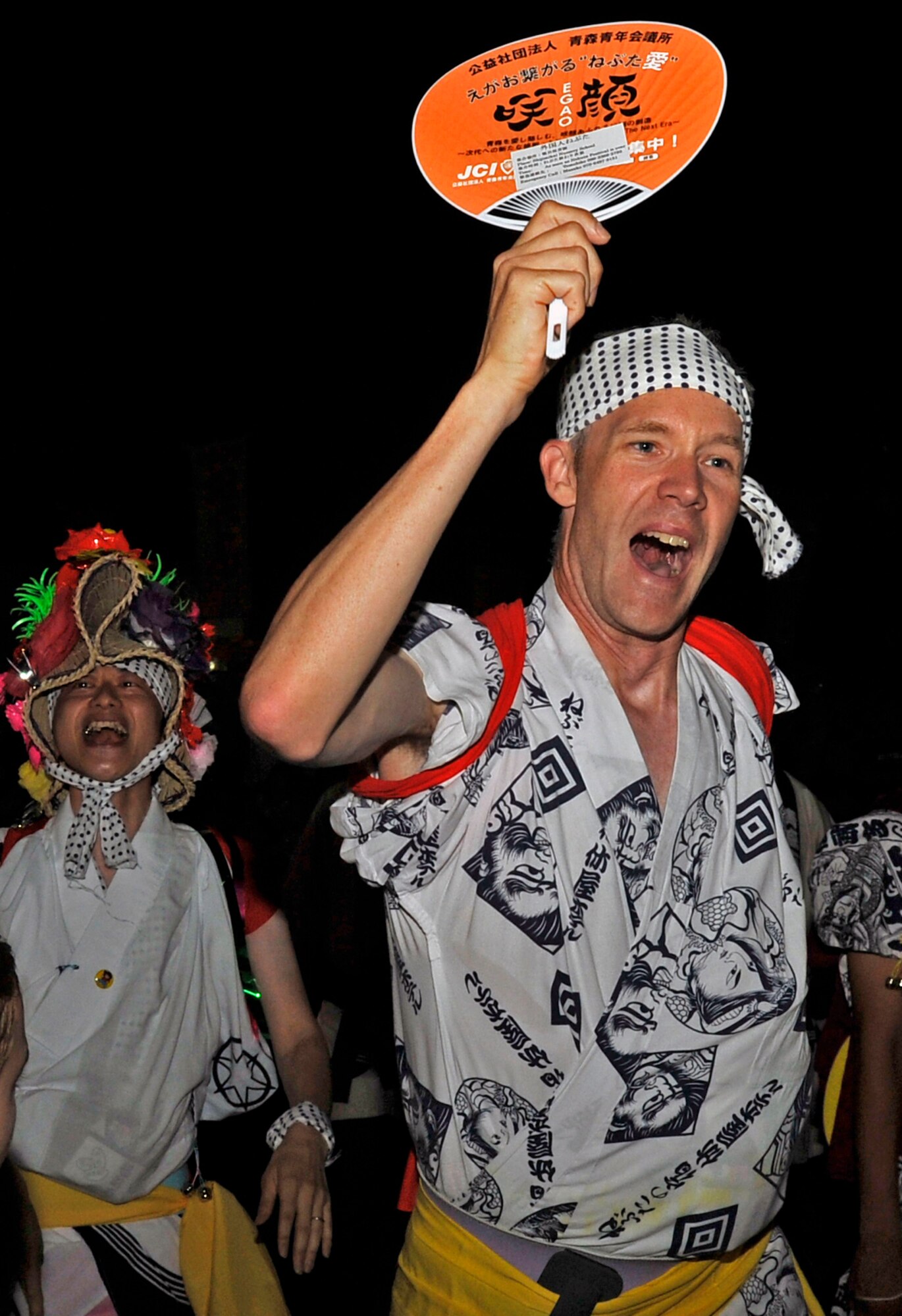 U.S. Air Force Lt. Col. R. Scott Grainger, 35th Civil Engineer Squadron commander, dances in the Aomori Nebuta Festival parade at Aomori City, Japan, Aug. 3, 2013. For Grainger, this was his second time experiencing the Nebuta Festival and he led various chants and dances throughout the night. (U.S. Air Force photo by Airman 1st Class Zachary Kee)