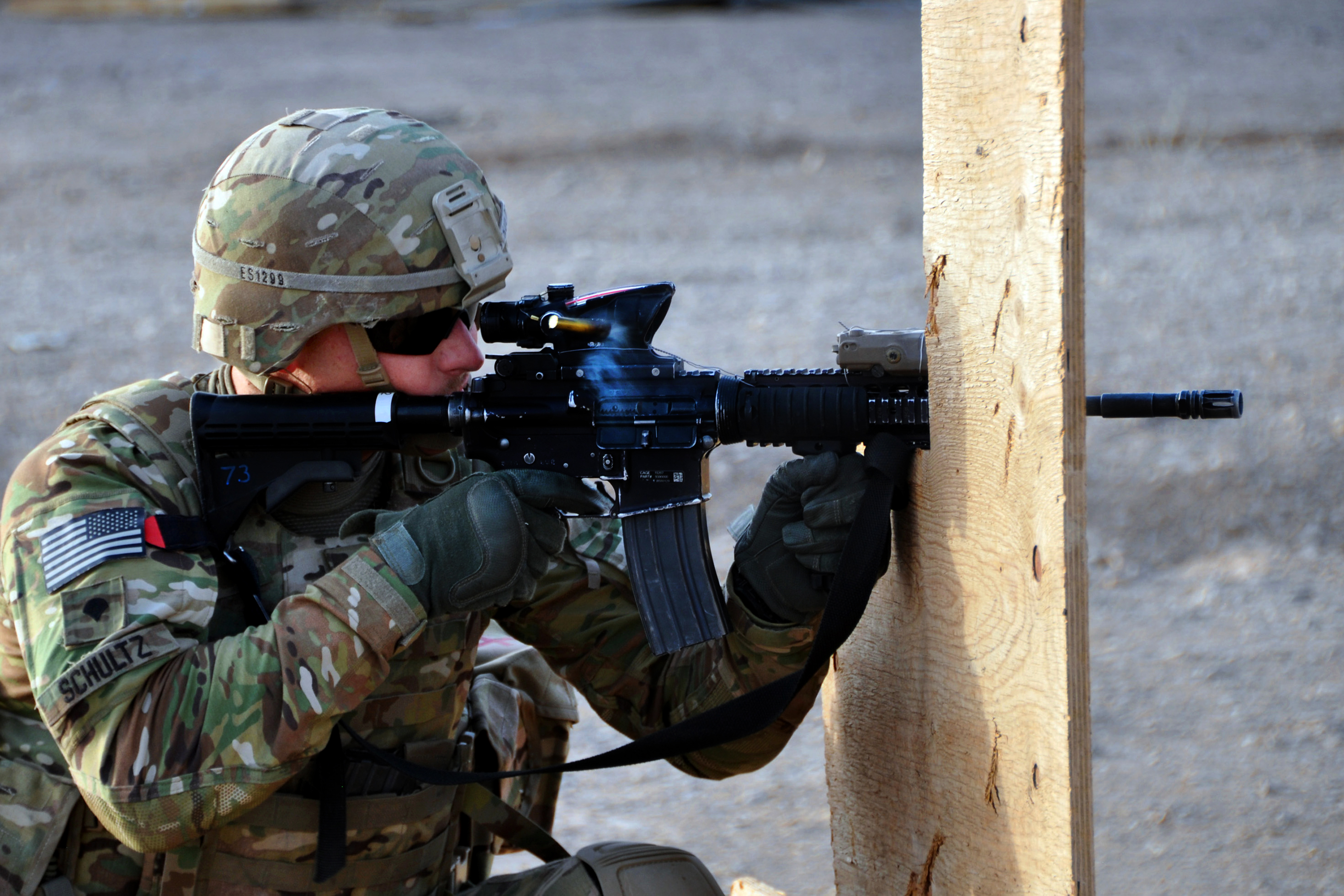 U.S. Army Spc. Edward Schultz fires an M4 rifle during a small arms ...