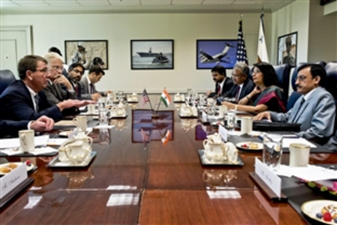 U.S. Deputy Defense Secretary Ash Carter, left, meets with Avinash Chander, scientific advisor to India's defense minister, to discuss issues of mutual importance at the Pentagon, Aug. 5, 2013.