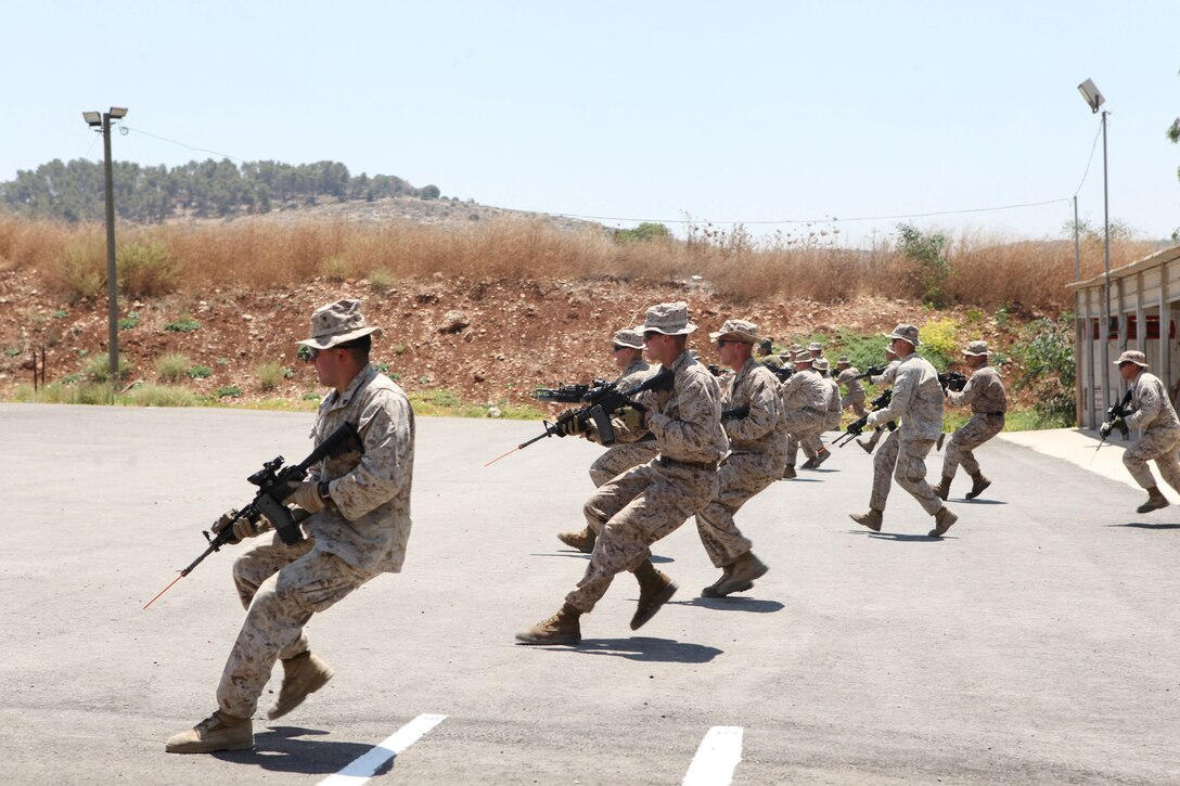 U.S. Marines and sailors with Black Sea Rotational Force 13 react to a target while training with the Israel Defense Force’s Counter-Terrorism Unit aboard Camp Adam, Israel, July 5, 2013.  The purpose of Noble Shirley 13 is to improve interoperability, understanding and cooperation between the IDF and U.S. Marines.  (U.S. Marine Corps photo by Staff Sgt. David Rakes, Sr./released)
