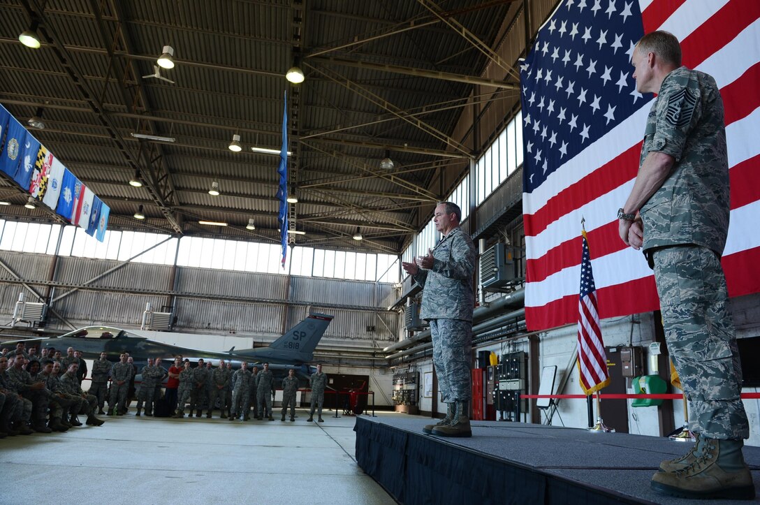 Air Force Chief of Staff Gen. Mark A. Welsh III and Chief Master Sgt. of the Air Force James Cody answer questions from Airmen during an Airman’s call in Hangar 1, Aug. 1, 2013. The senior leaders visited the base to thank Airmen and their families for their service and dedication, as well as address current challenges facing the Air Force. 