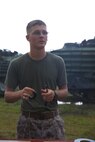 Cpl. Jacob A. Richardson, a combat engineer with 8th Engineer Support Battalion, 2nd Marine Logistics Group, creates a doughnut charge, which will be used to remove a doorknob while breaching a door during a field exercise aboard Camp Lejeune, N.C., July 29, 2013. The battalion trained with 2nd Assault Amphibian Battalion, 2nd Marine Division on the basics of urban and field demolitions. 