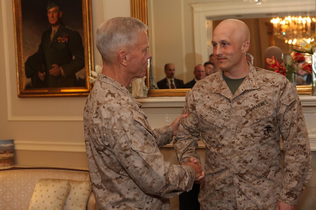 Gen. James F. Amos, the 35th Commandant of the Marine Corps, promotes Jody R. Nelson to the rank of Chief Warrant Officer 2 in the Home of the Commandants, Marine Barracks Washington, D.C., on Aug. 1, 2013. (U.S. Marine Corps photo by Sgt. Marionne T. Mangrum)