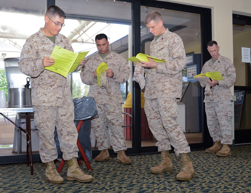 A group of Marines browse through a fair program during the Hawaii Defense Tech and Intelligence Career Fair, in the Fairways Ballroom at the Kaneohe Klipper Golf Course, July 30, 2013. Service members, Department of Defense civilians and contractors were invited to this free event. The companies at the fair pertained to professionals in fields including information technology, software engineering, aerospace, logistics, cyber security, project management, network administration and linguistics. For more information, visit http://www.transitioncareers.com, or call the Marine Corps Community Services Transition Readiness Program at 257-7787/7790. (U.S. Marine Corps photo by Kristen Wong)
