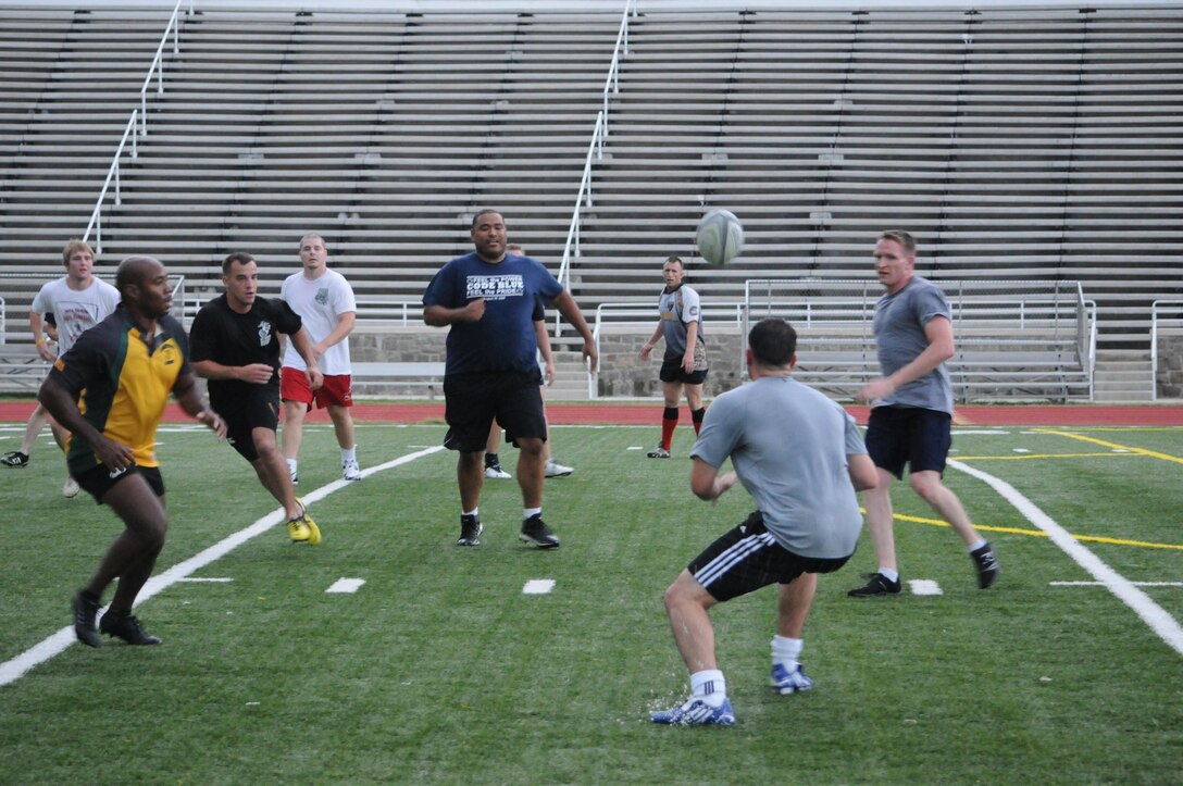 Members of the Quantico Hooligans rugby team participate in a scrimmage at Butler Stadium on Aug. 1, their first day of practice for the season. The team started practicing early this year to prepare for a match against the 1st Battalion of the Scottish Royal Regiment. 
