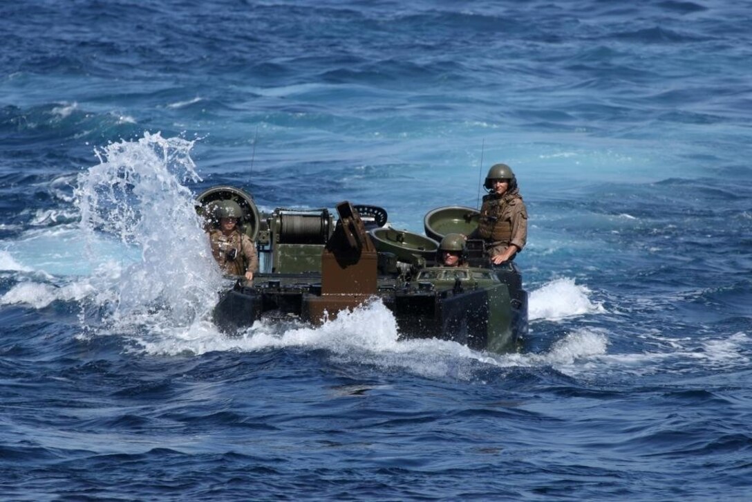130708-M-OH054-232

PACIFIC OCEAN ABOARD USS HARPERS FERRY (LSD-49) – Marines with Amphibious Assault Vehicle Detachment, Battalion Landing Team 1/4, 13th Marine Expeditionary Unit maneuver their AAV-7’s toward the USS Harpers Ferry (LSD-49) to embark for Composite Training Exercise, July 8, 2013. Composite Training Exercise (COMTUEX) is scenario driven exercise aimed at integrating the 13th MEU and the ships of the Boxer Amphibious Ready Group through simulated real-world operational events. (U.S. Marine Corps photo by Sgt. Christopher O’Quin/Released)

