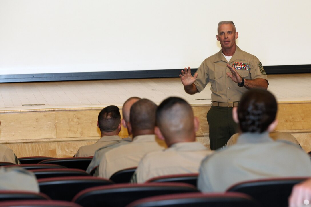 Sgt. Maj. Micheal P. Barrettt, the 17th Sergeant Major of the Marine Corps, and attendees of the 2013 Sergeant Major of the Marine Corps Symposium are photographed at Joint Base Fort Myer-Henderson Hall, Va., on Aug. 2, 2013. (U.S. Marine Corps photo by Sgt. Marionne T. Mangrum)