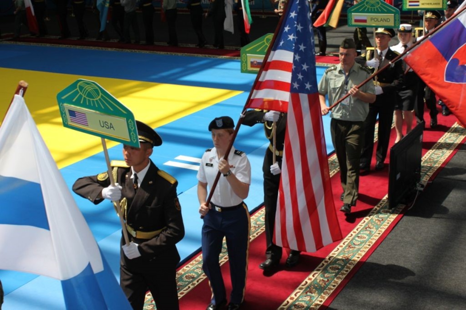 CPT Amber Jones, Missouri National Guard, carries the flag for team USA