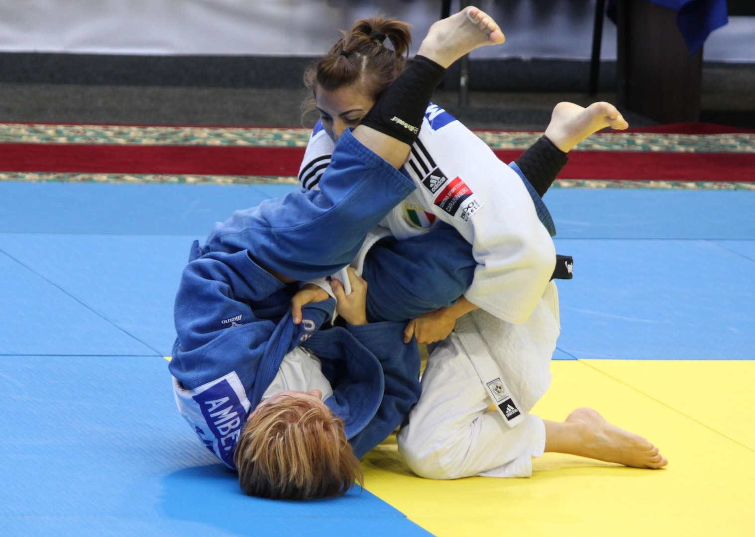 CPT Amber Jones (Missouri National Guard) (left) attempts an arm bar of her opponent at the 2013 CISM World Military Judo Championship in Astana, Kazakhstan 30 Jun to 7 July.