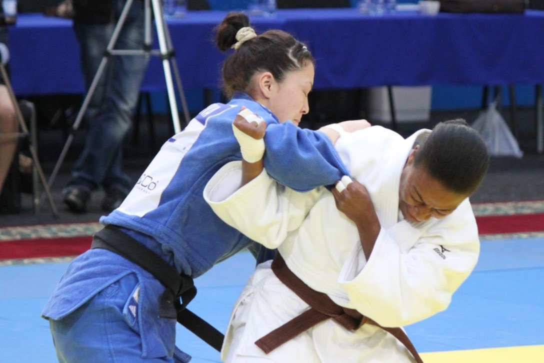Army 2LT Danielle Smith of the Georgia National Guard attempts a throw of her opponent at the 2013 CISM World Military Judo Championship in Astana, Kazakhstan 30 Jun to 7 July.