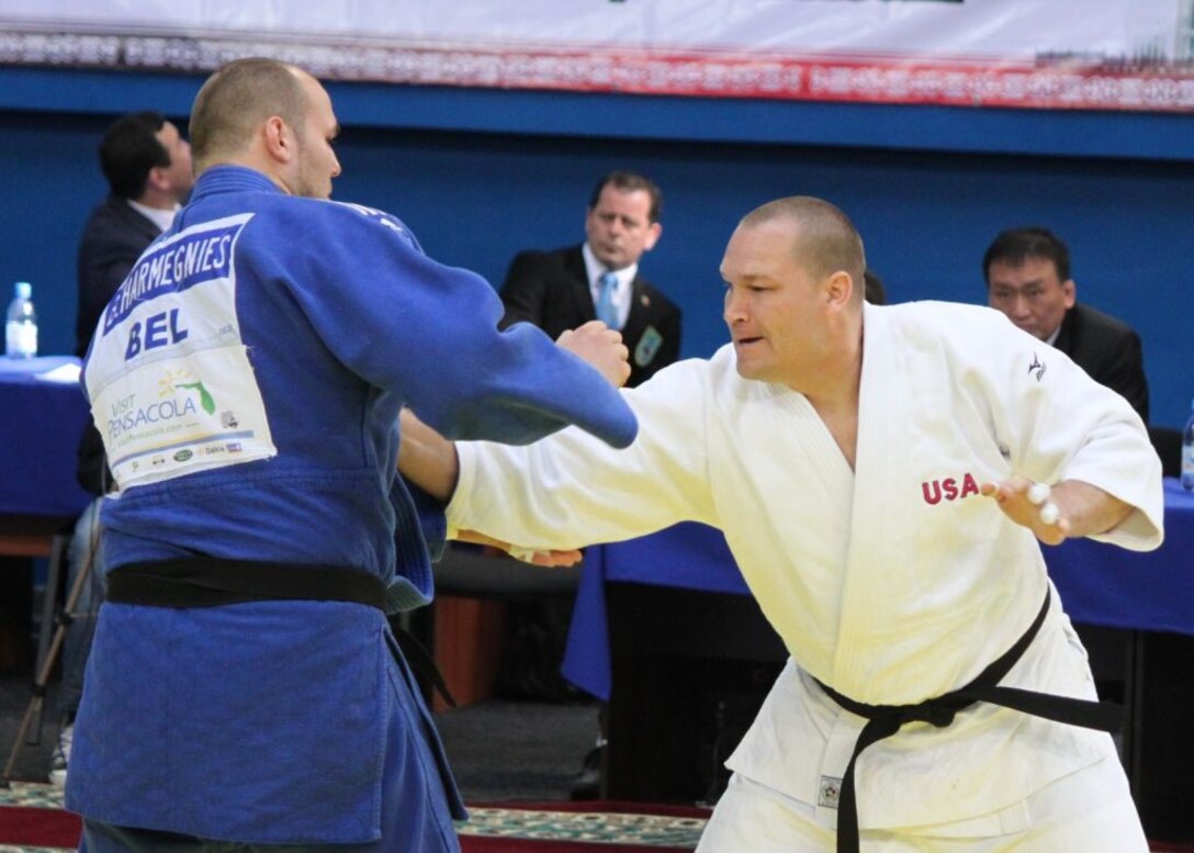 SFC Jeff Deickmann grabs for his opponent from Belgium at the 2013 CISM World Military Judo Championship in Astana, Kazakhstan 30 Jun to 7 July.