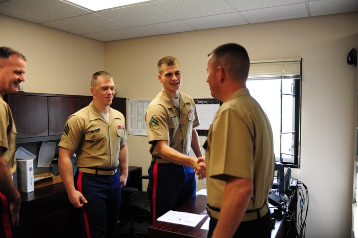 Brig. Gen. James Bierman, commanding general of Marine Corps Recruit Depot San Diego and the Western Recruiting Region, greets Marines of the operations section of the 9th Marine Corps District headquarters, Aug. 6. Bierman traveled to the district to greet and address Marines as the new commanding general of MCRD San Diego/WRR.