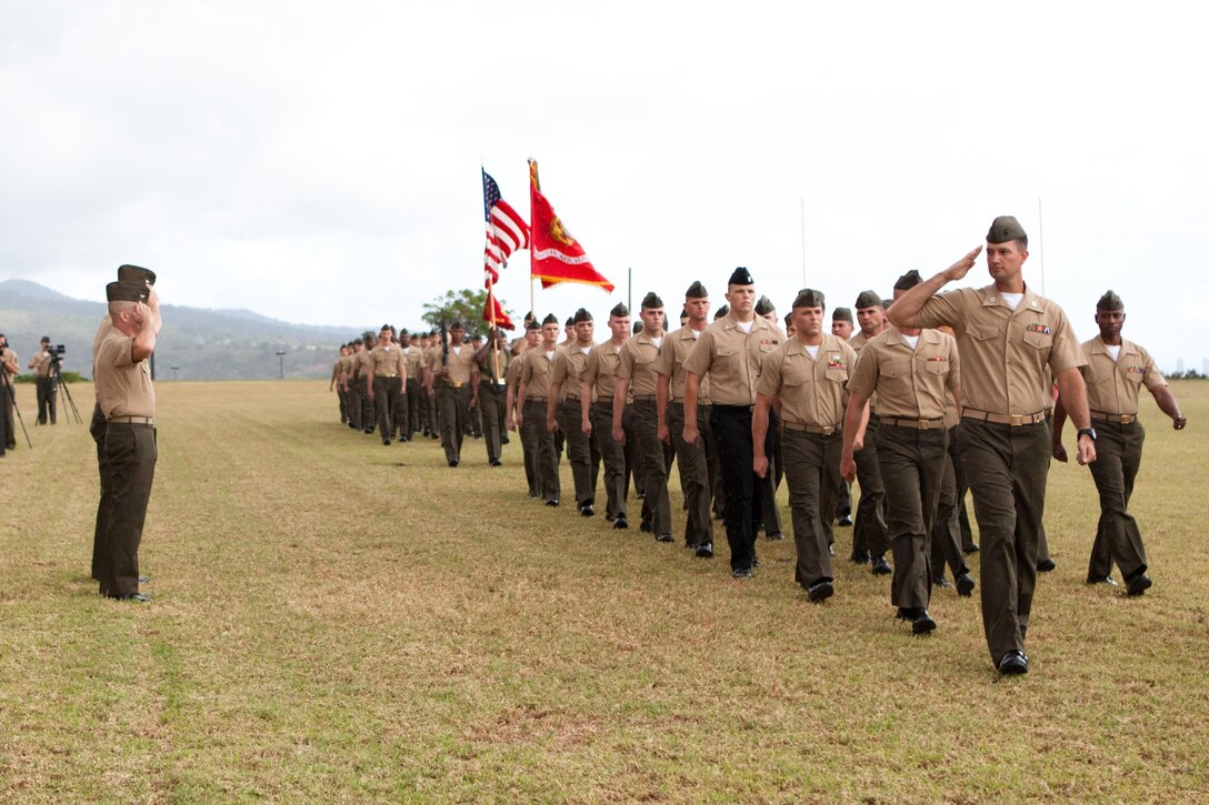 Col. Darric M. Knight and Col. Brent S. Willson, the former and current commanding officers of Headquarters and Service Battalion, U.S. Marine Corps Forces, Pacific, stand side-by-side as they review the parade formation during the pass and review of the change of command ceremony here July 26. Willson is leaving Hawaii and will rejoin his family in San Diego, Calif.