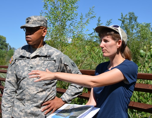 Alicia Austin-Johnson, project manager, USACE, Albuquerque district, discusses the Middle Rio Grande Restoration Project with Col. Turner at the project site.

