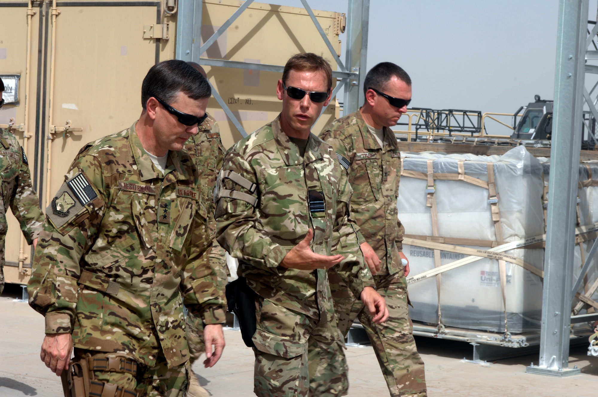 Royal Air Force Squadron Leader William Andrew, Chief of the Combined Air Terminal Operations, briefs Lt. Gen. John Hesterman III, commander U.S. Air Forces Central Command, about aerial operations at Kandahar Airfield, Afghanistan, July 28, 2013. Hesterman is the Combined Force Air Component Commander responsible for developing contingency plans and conducting air operations in a 20-nation area of responsibility covering Central and Southwest Asia. (U.S. Air Force photo/Senior Airman Jack Sanders)