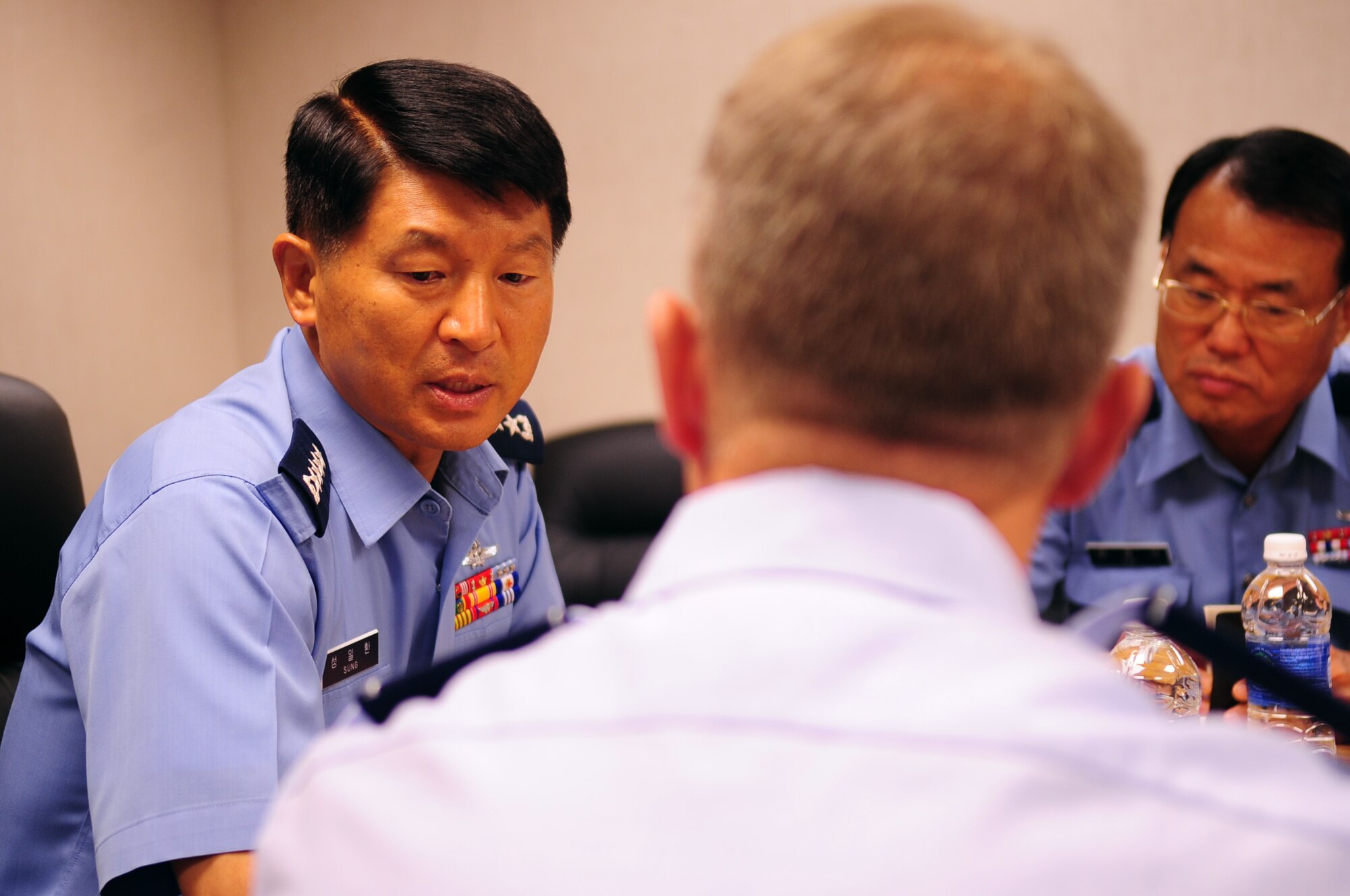 U.S. Air Force Brig. Gen. Mark Kelly, 354th Fighter Wing commander, speaks with Republic of Korea Air Force chief of staff, Gen. Ilhwan Sung, during his visit Aug. 5, 2013, Eielson Air Force Base, Alaska. During the brief, Kelly explained the size of Eielson’s air space for RED FLAG-Alaska 13-3 participants. (U.S. Air Force photo by Airman 1st Class Lauren-Taylor Levin/Released)