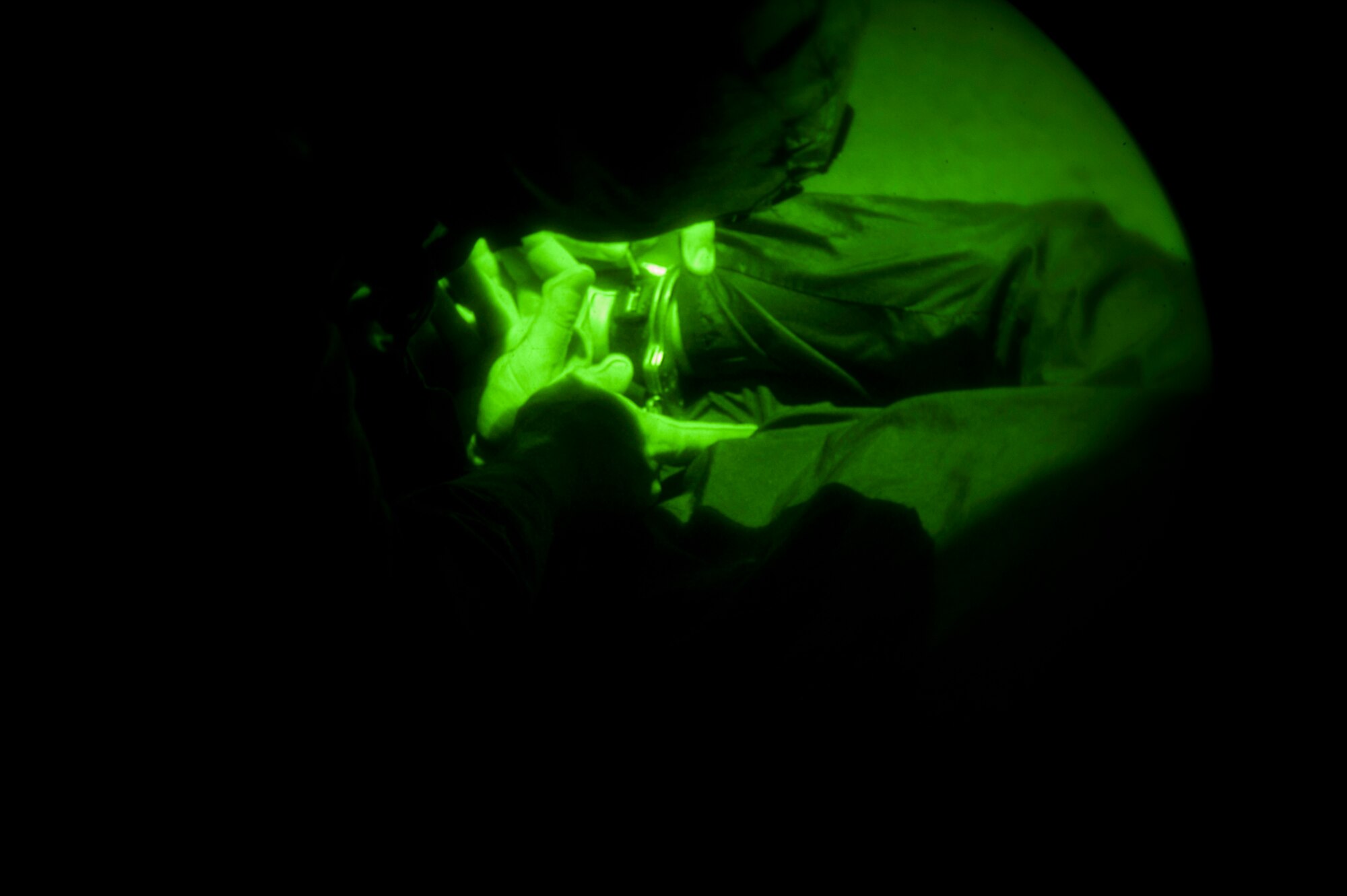 KUNSAN AIR BASE, Republic of Korea -- Airman 1st Class Anthony Kelly, 8th Security Forces Squadron, adjusts hand cuffs on a “captive” during exercise Beverly Midnight 13-3, Aug. 7, 2013. Kelly was part of a team of Airmen who responded to a simulated ground attack on the base. (U.S. Air Force photo by Senior Airman Clayton Lenhardt/Released)