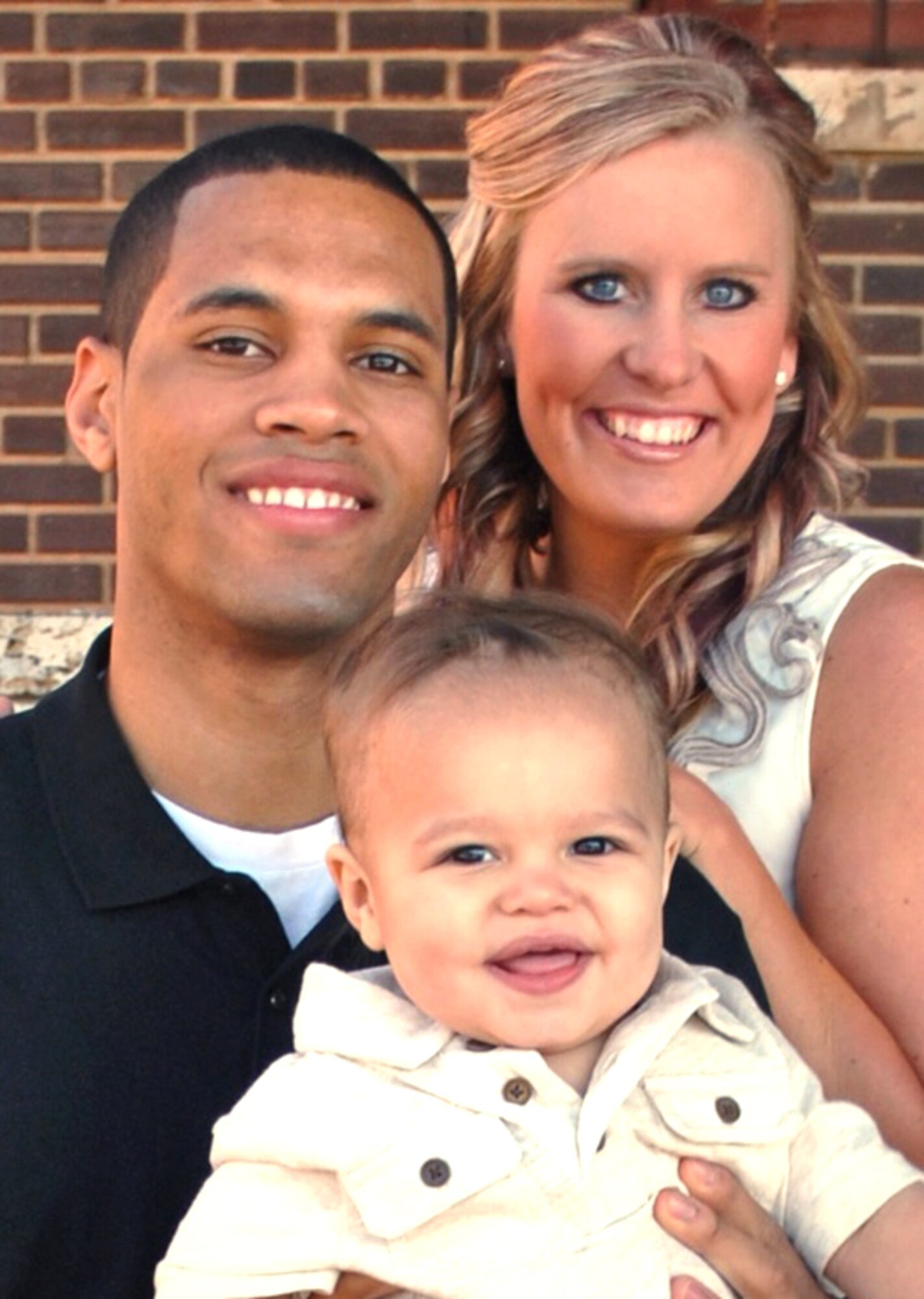 Kaylee Mitchell, right, Airman 1st Class Lawrence Mitchell, left, and their son, Kai. (Courtesy photo)