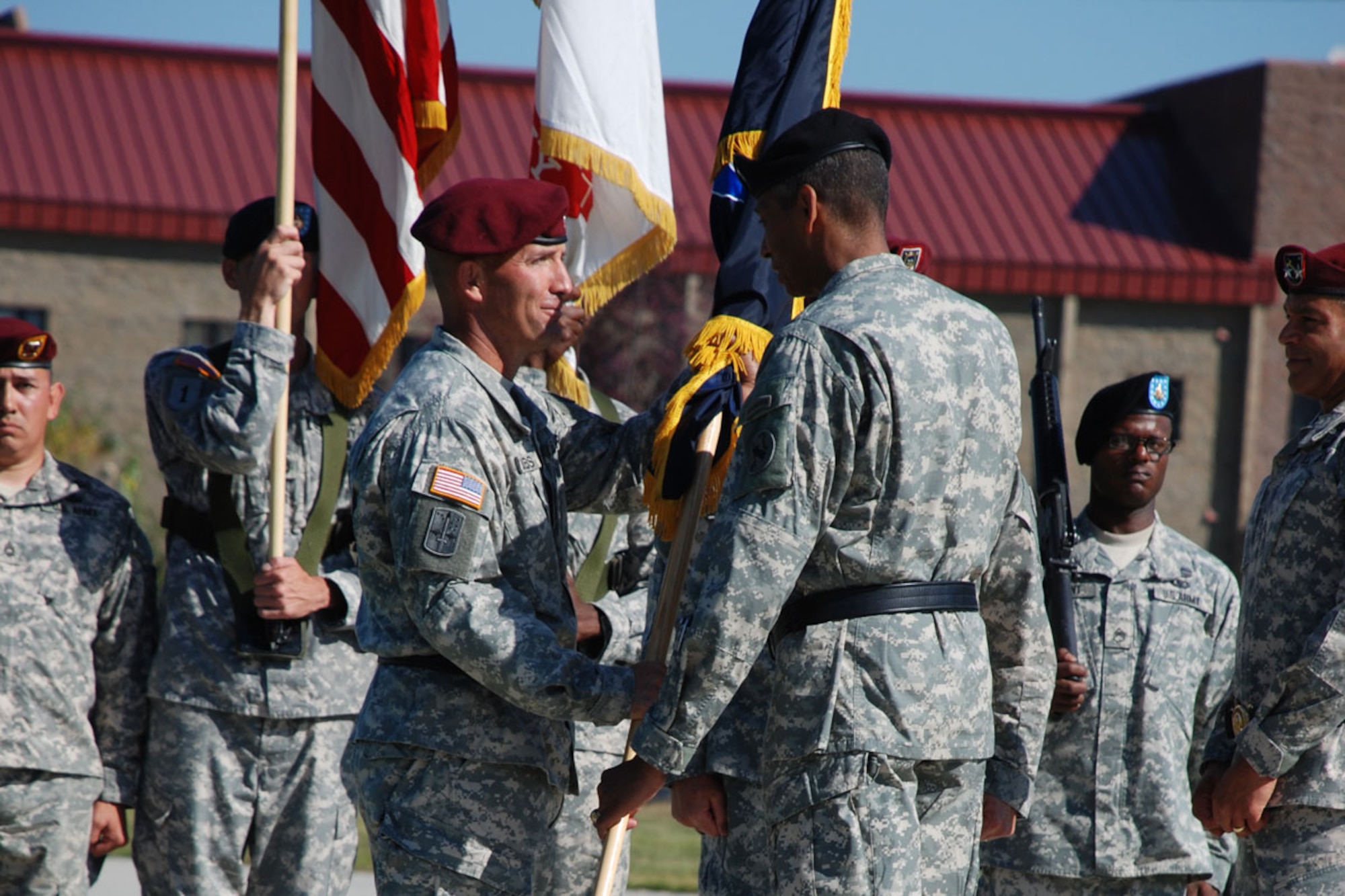 Army Gen. Vincent Brooks (right), U.S. Army Pacific commanding general, hands the U.S. Army Alaska colors and the responsibility of commanding USARAK to Army Maj. Gen. Michael Shields during a change-of-command ceremony at Pershing Parade Field Tuesday. (Photos courtesy of U.S. Army Alaska)