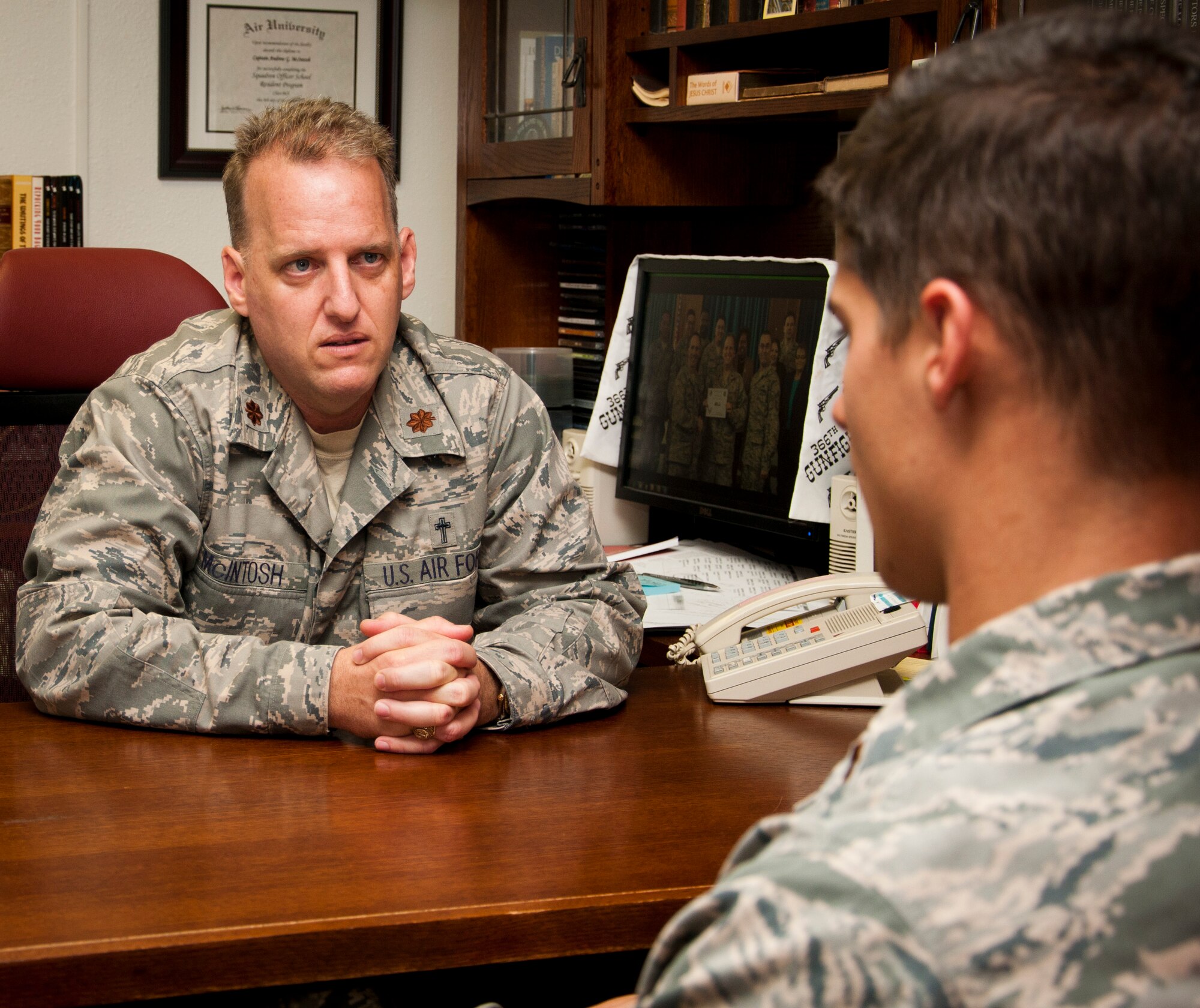 Chaplain (Maj.) Andrew McIntosh, 47th Flying Training Wing gives marriage advice to a service member on Laughlin Air Force Base, Texas, Aug. 6, 2013. McIntosh is one of a few chaplains in the Air Force who is officially licensed in marriage counseling. (U.S. Air Force photo/Airman 1st Class Jimmie D. Pike)