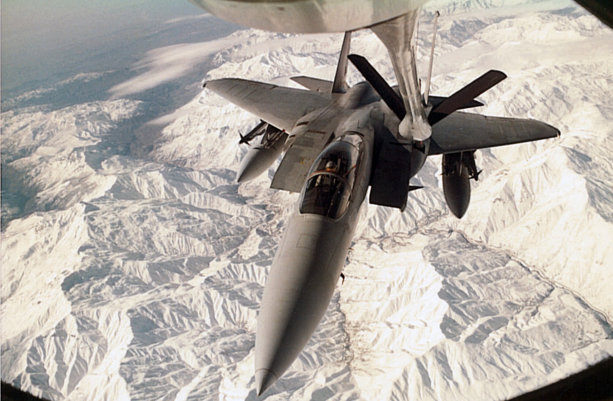 A KC-135 Stratotanker refuels an F-15 over the Turkey-Iraq border during Operation Desert Storm.  The KC-135 is ideal for aerial refueling because it is jet powered, which allows it to reach and maintain a speed at which a fighter can be refueled.  (Courtesy photo)