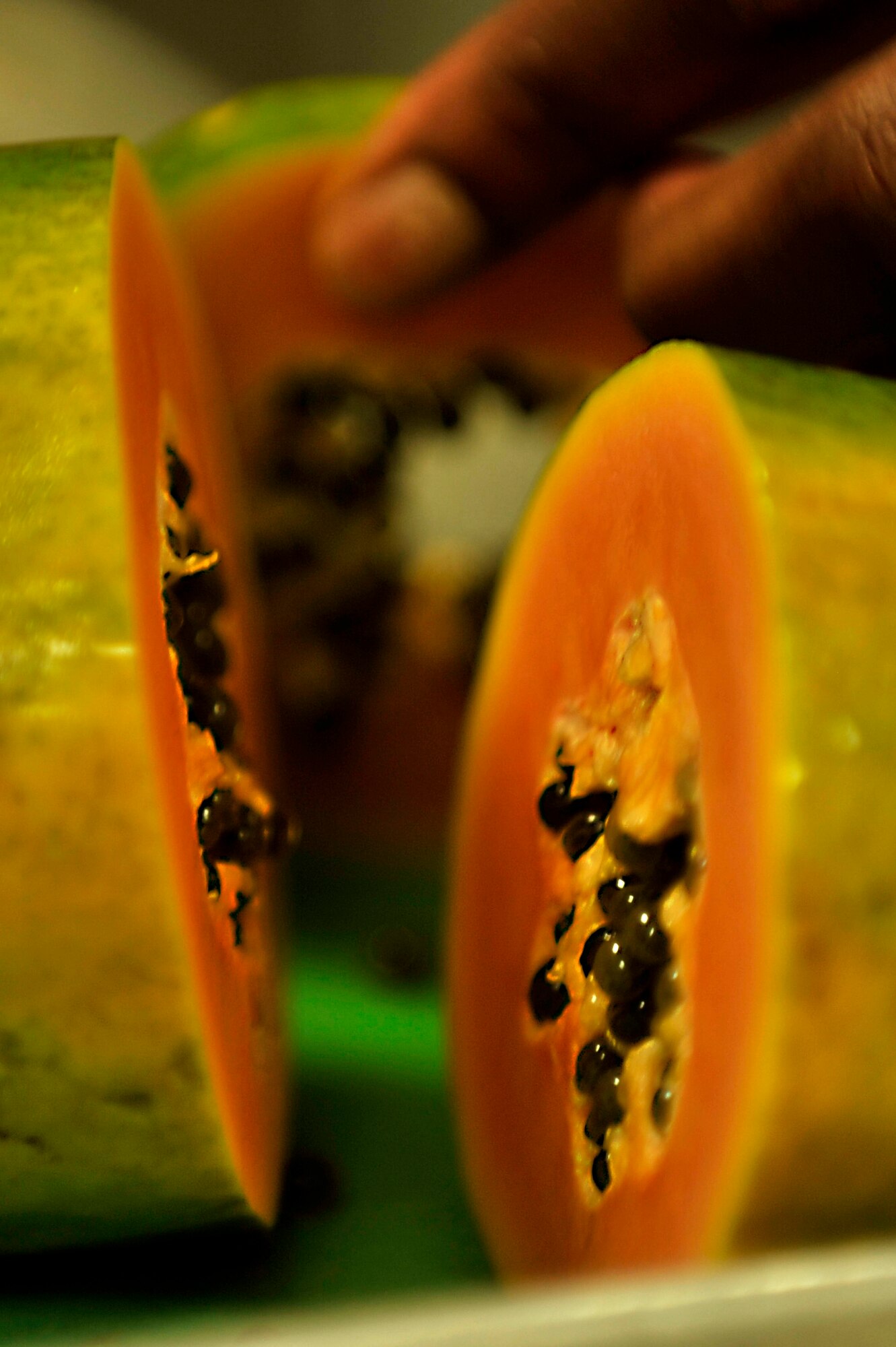 Papaya sits on a cutting board during an Iron Chef competition at the Chief Master Sgt. Emerson Williams Dining Facility, Shaw Air Force Base, S.C., July 30, 2013. Papaya was the secret ingredient that needed to be used in each dish prepared during the competition. (U.S. Air Force photo by Airman 1st Class Jensen Stidham/Released)