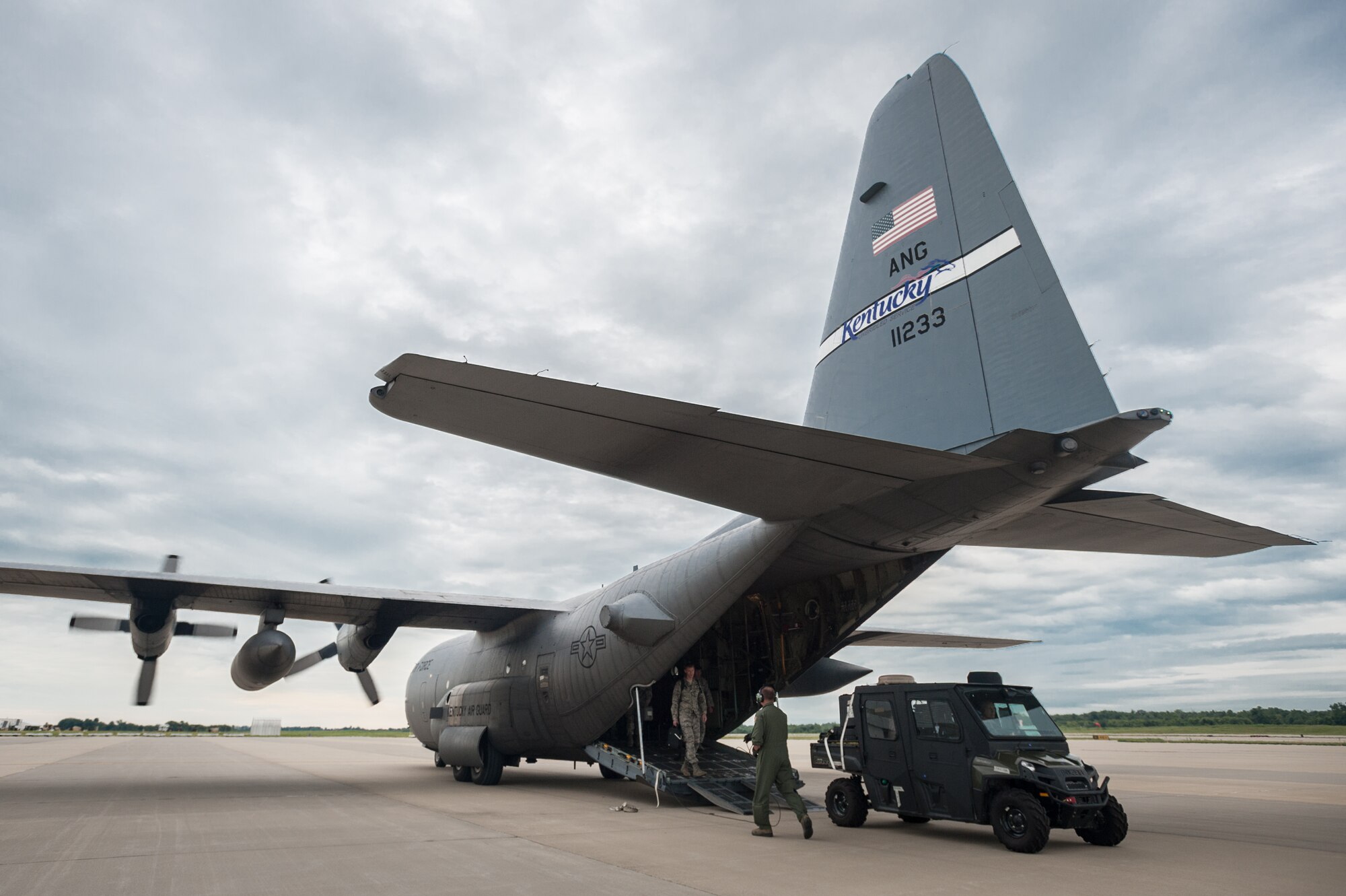 Members of the Kentucky Air National Guard’s 123rd Contingency Response Group offload an all-terrain vehicle at MidAmerica St. Louis Airport in Mascoutah, Ill., on Aug. 5, 2013, as part of Exercise Gateway Relief, a U.S. Transportation Command-directed earthquake-response scenario. The vehicle, which serves as a mobile command post, is equipped with satellite communications gear that allows a Joint Assessment Team to establish secure voice and data communications with USTRANSCOM officials upon landing at a non-functional airfield, reporting the status of facilities and the ability to support relief operations. (U.S. Air National Guard photo by Maj. Dale Greer)